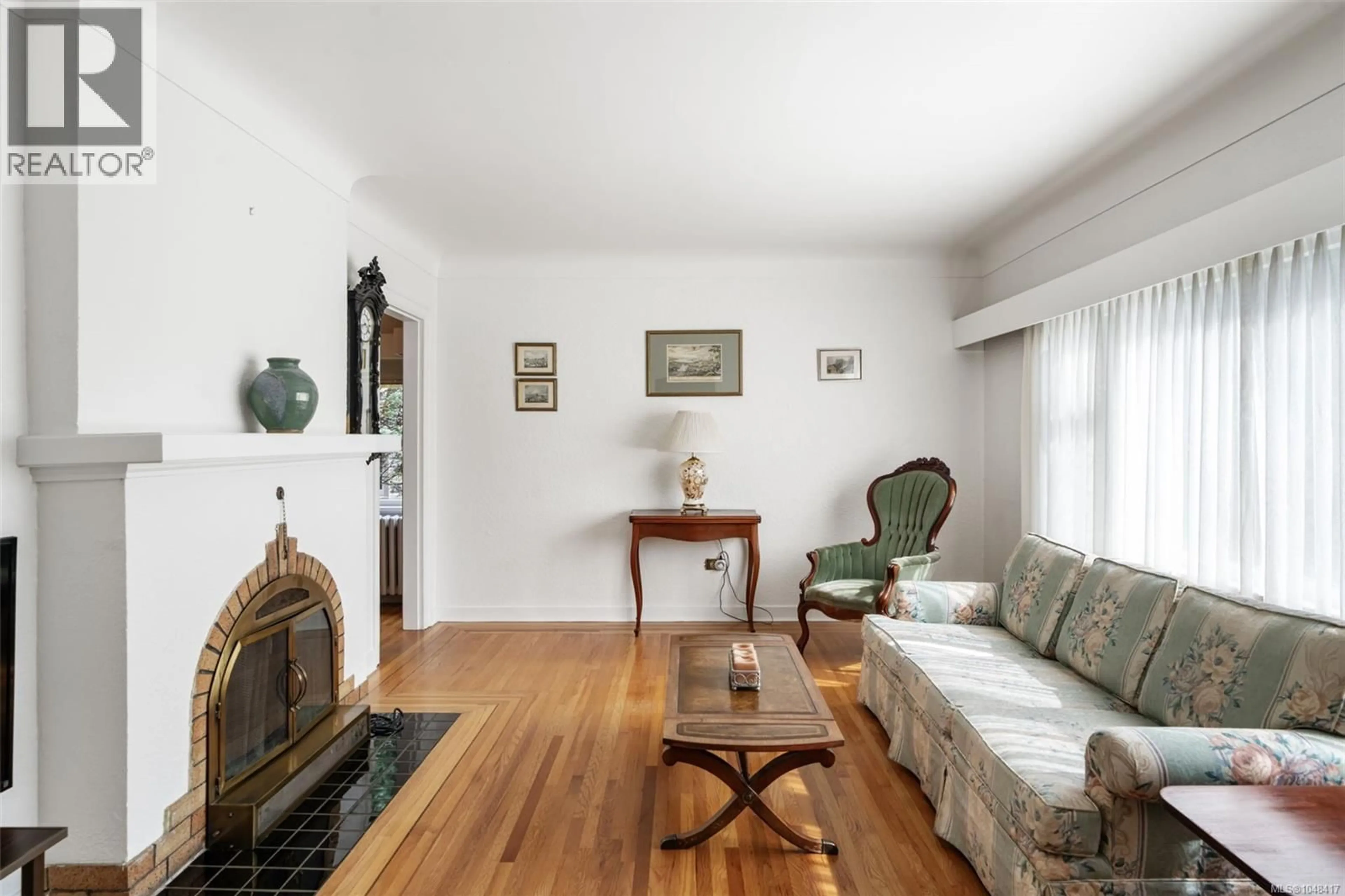 Living room with furniture, wood/laminate floor for 1258 ROCKLAND AVENUE, Victoria British Columbia V8V3J2