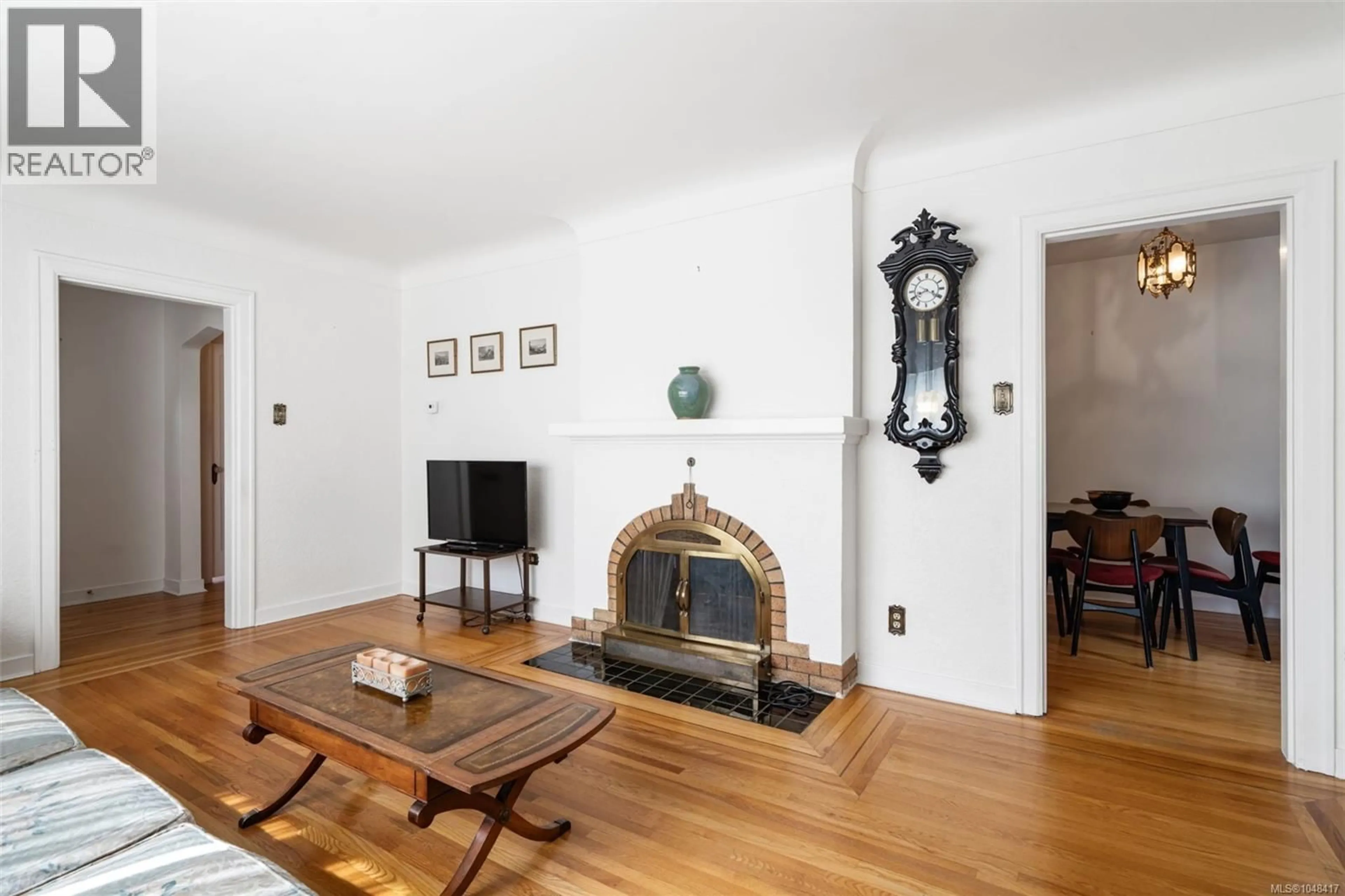 Living room with furniture, wood/laminate floor for 1258 ROCKLAND AVENUE, Victoria British Columbia V8V3J2