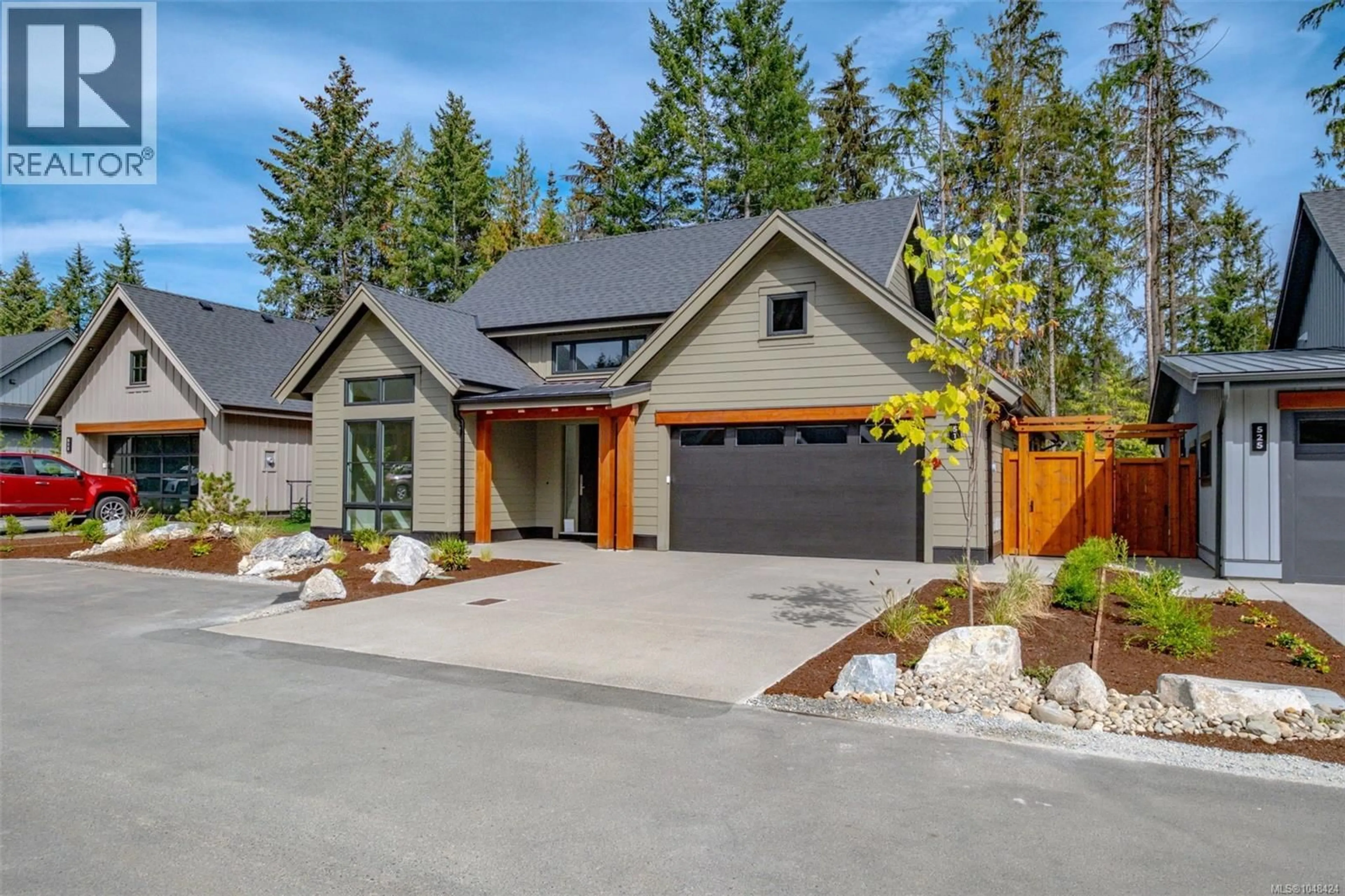 Home with vinyl exterior material, street for 519 HOLE-IN-ONE DRIVE, Qualicum Beach British Columbia V9K1B0
