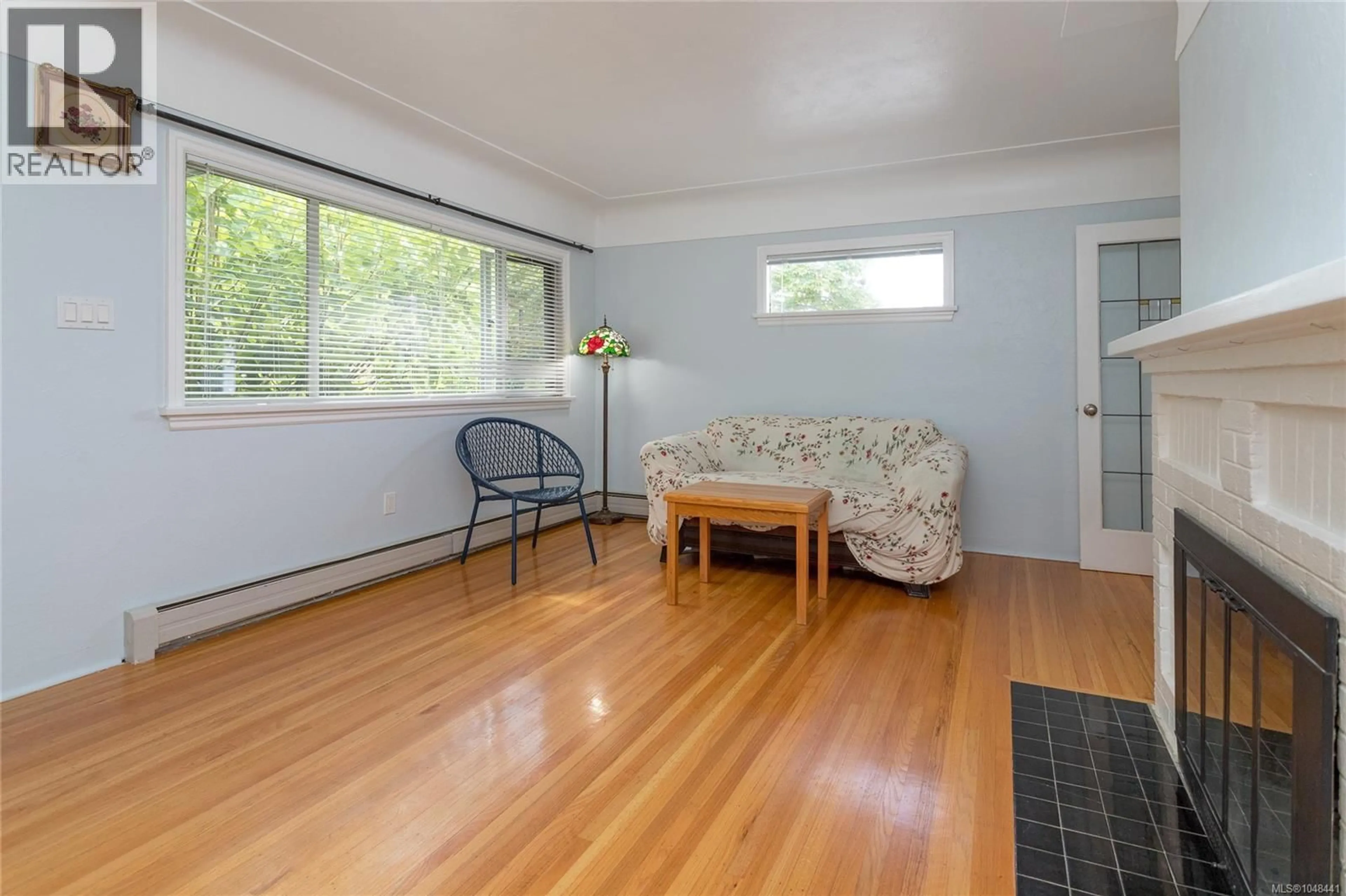 Living room with furniture, wood/laminate floor for 2068 MILTON STREET, Oak Bay British Columbia V8R5A4