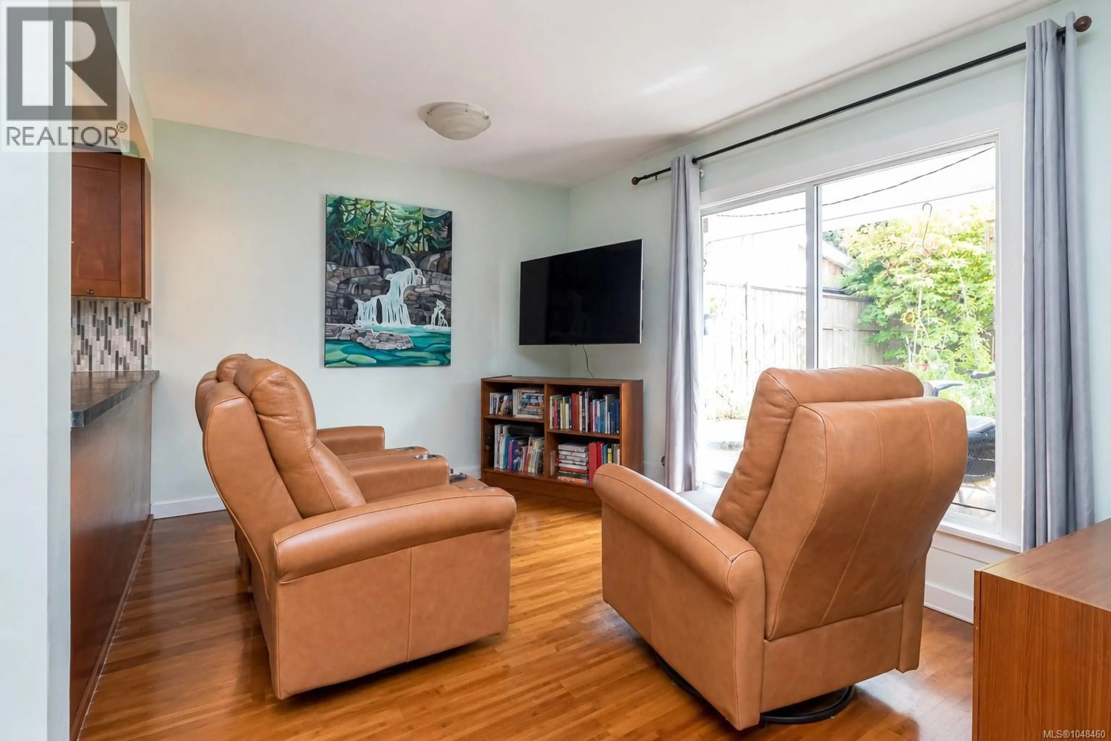 Living room with furniture, wood/laminate floor for 104 - 724 SEA TERRACE, Victoria British Columbia V9A3R6