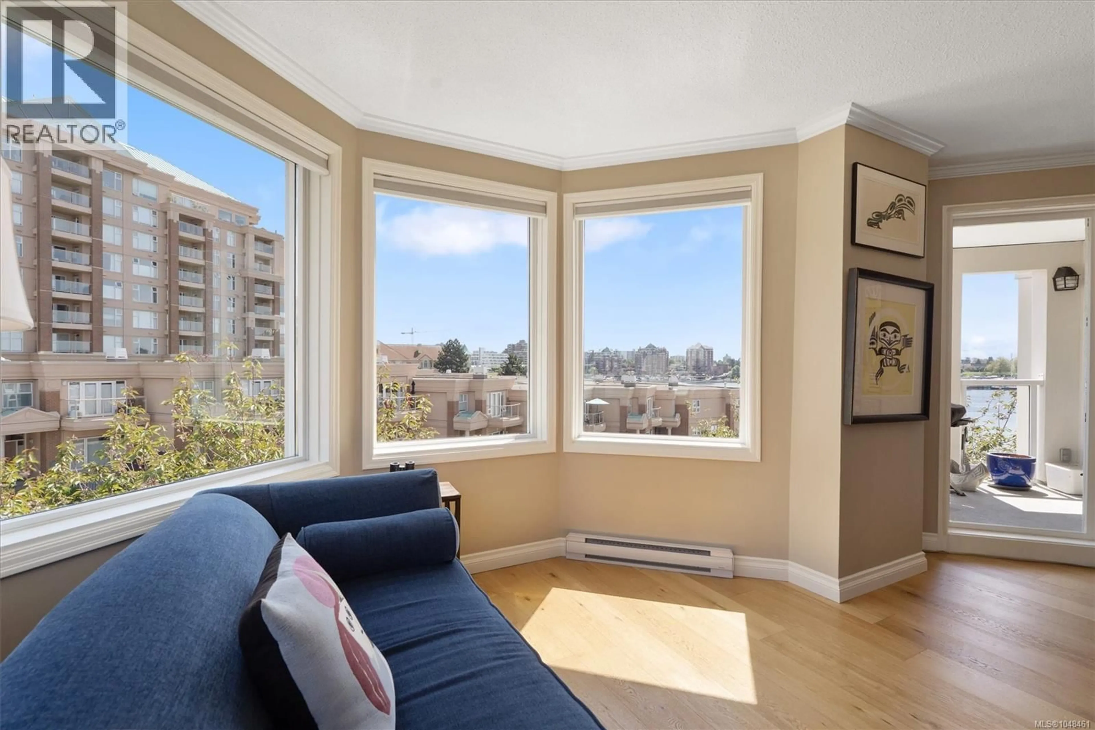 Living room with furniture, wood/laminate floor for 318 - 10 PAUL KANE PLACE, Victoria British Columbia V9A7J8