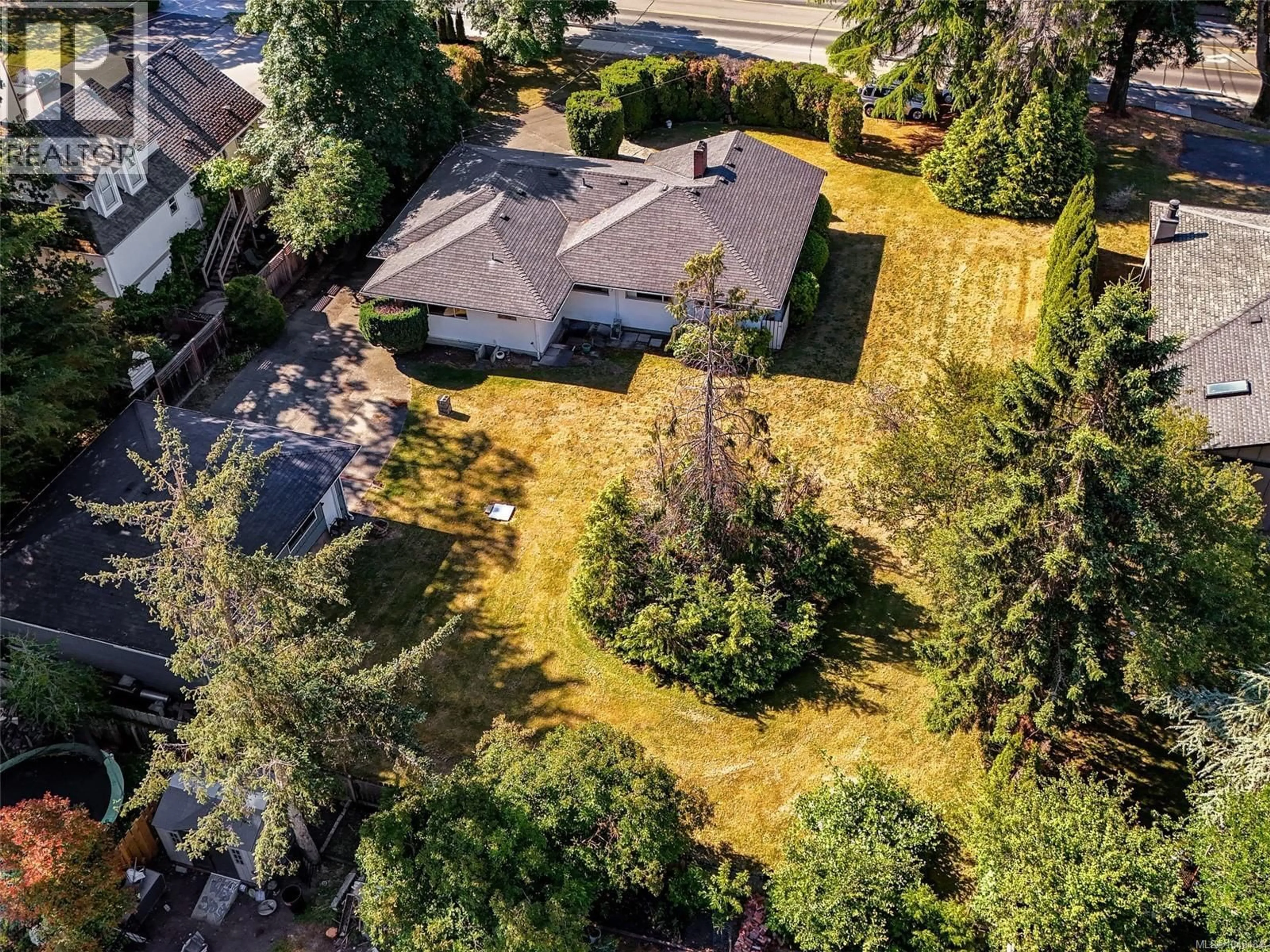 A pic from outside/outdoor area/front of a property/back of a property/a pic from drone, street for 1716 FELTHAM ROAD, Saanich British Columbia V8N2A3