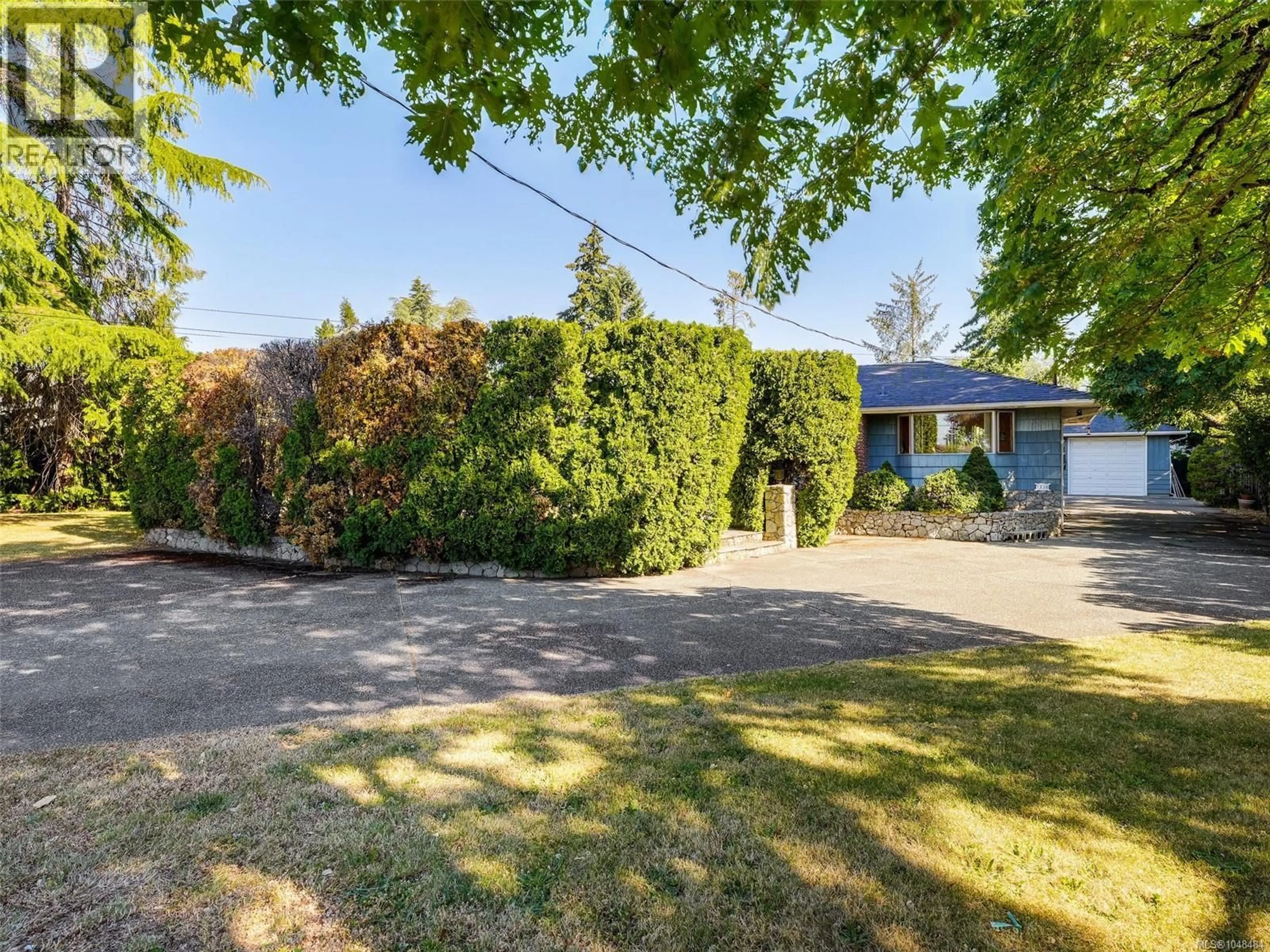 A pic from outside/outdoor area/front of a property/back of a property/a pic from drone, street for 1716 FELTHAM ROAD, Saanich British Columbia V8N2A3