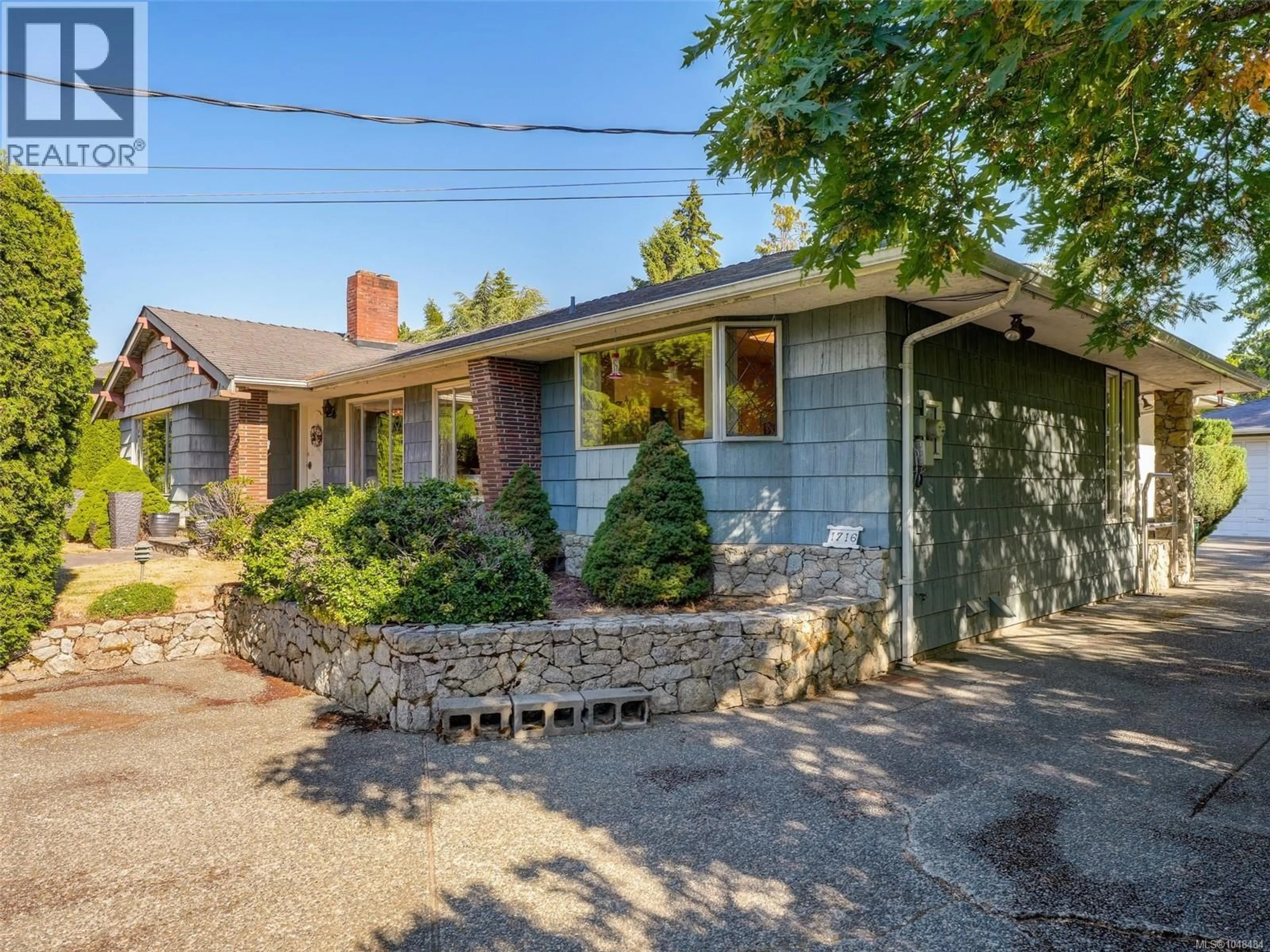 Home with brick exterior material, street for 1716 FELTHAM ROAD, Saanich British Columbia V8N2A3