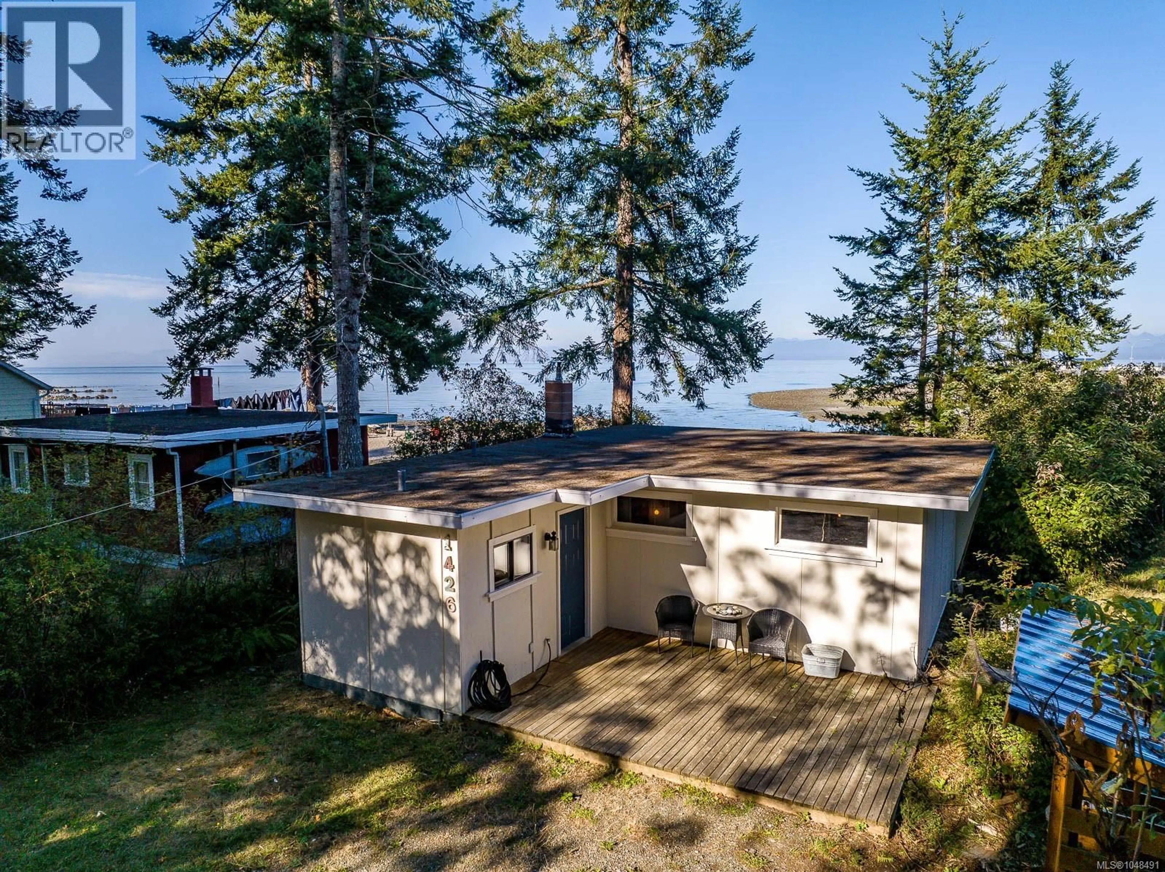 A pic from outside/outdoor area/front of a property/back of a property/a pic from drone, water/lake/river/ocean view for 1426 WILKINSON ROAD, Comox British Columbia V9M4B3