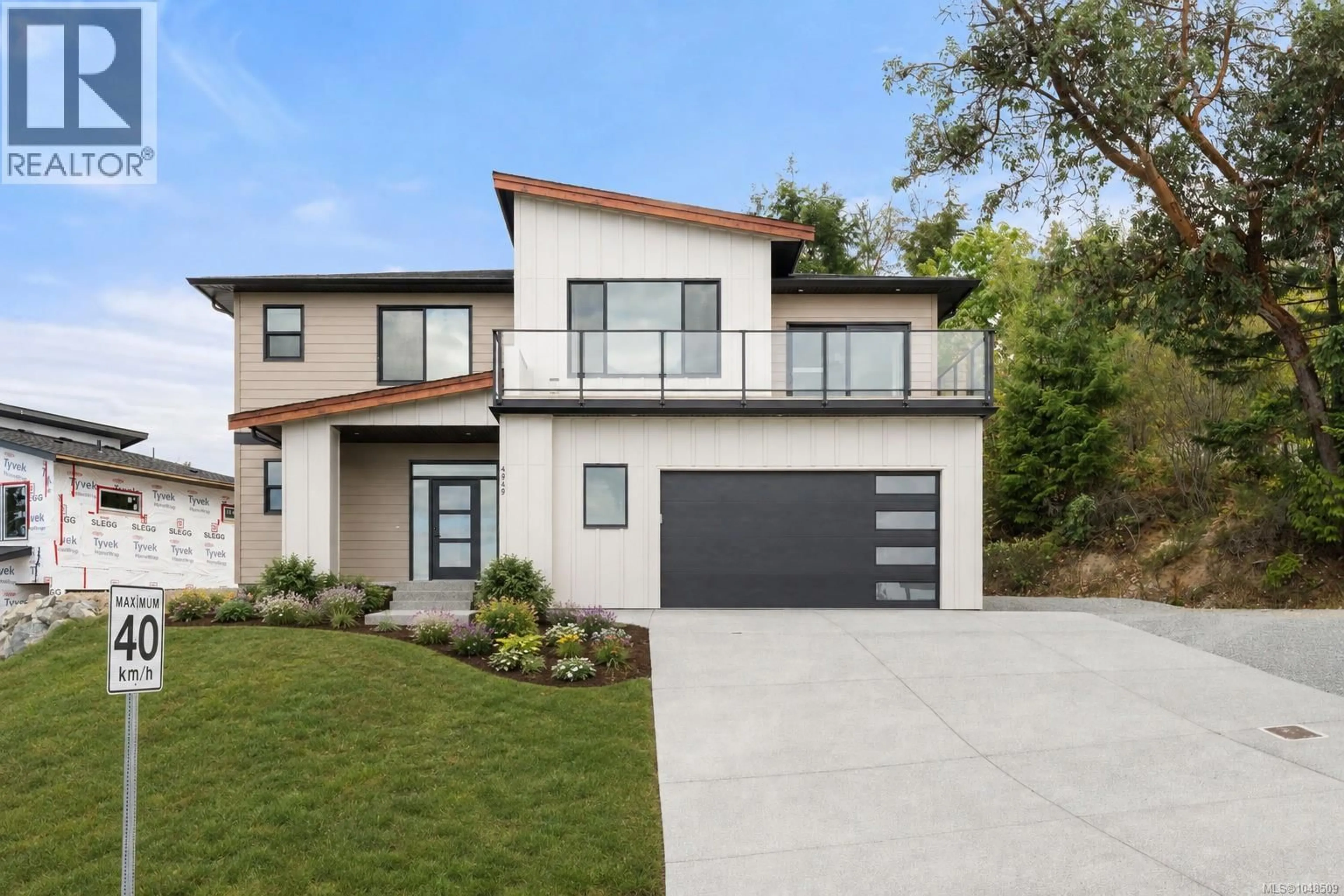 Home with brick exterior material, street for 4949 DIXON LANE, Lantzville British Columbia V0R2H0