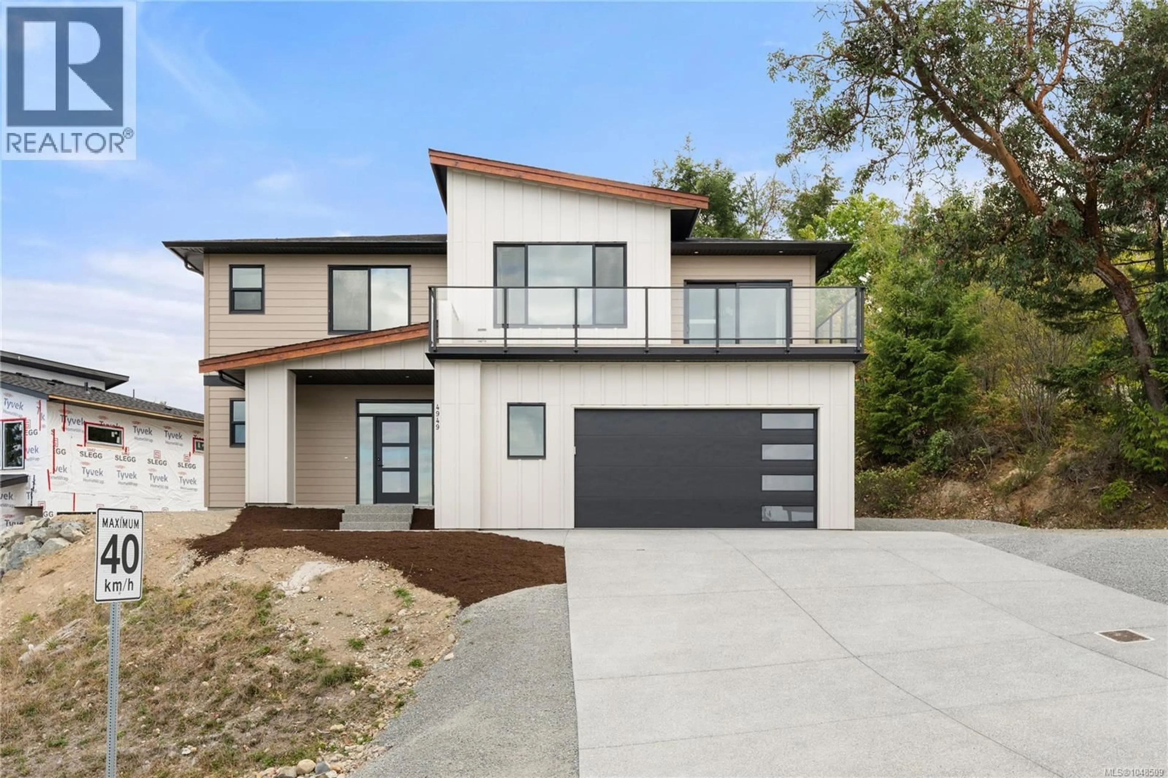 Home with brick exterior material, street for 4949 DIXON LANE, Lantzville British Columbia V0R2H0