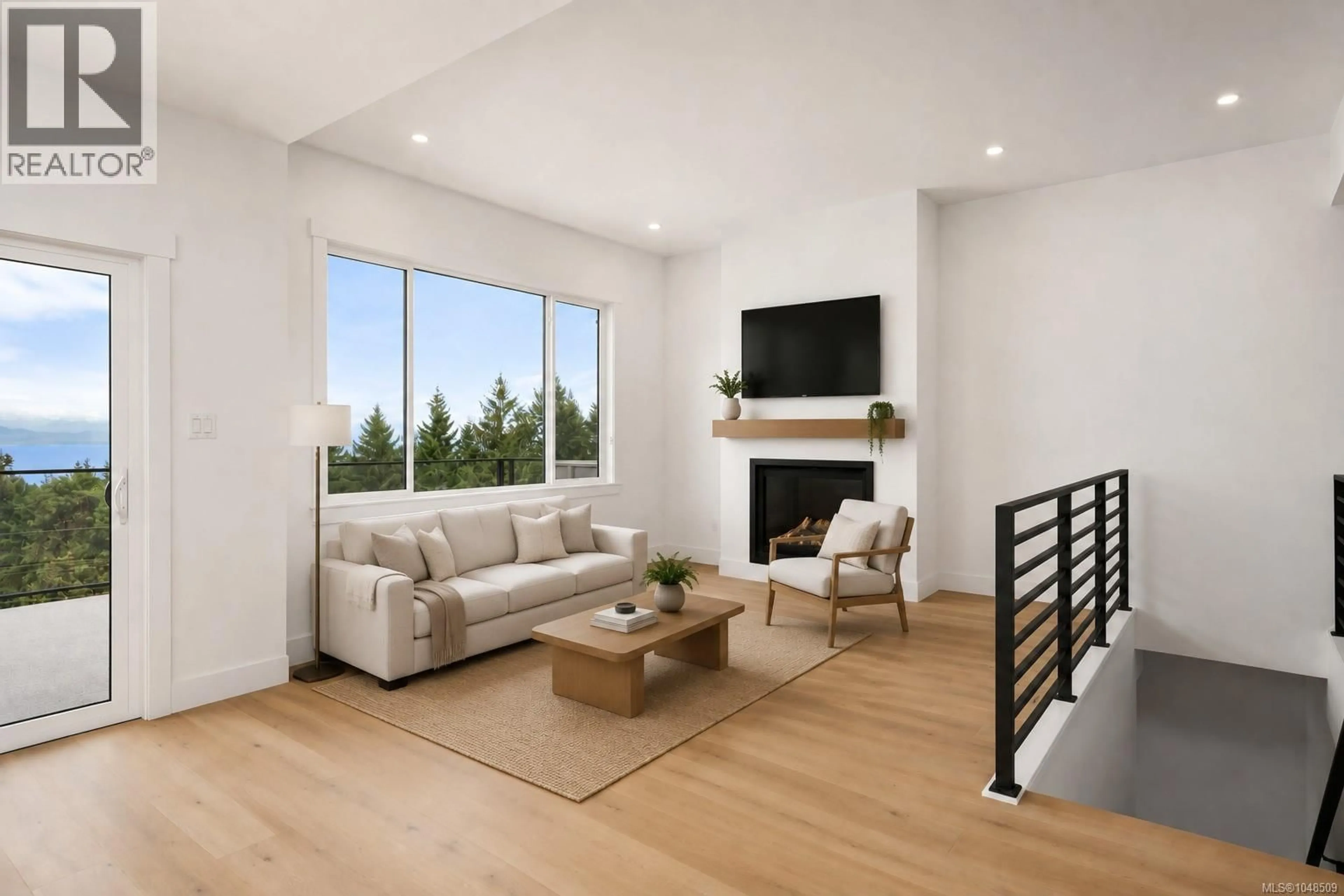 Living room with furniture, wood/laminate floor for 4949 DIXON LANE, Lantzville British Columbia V0R2H0