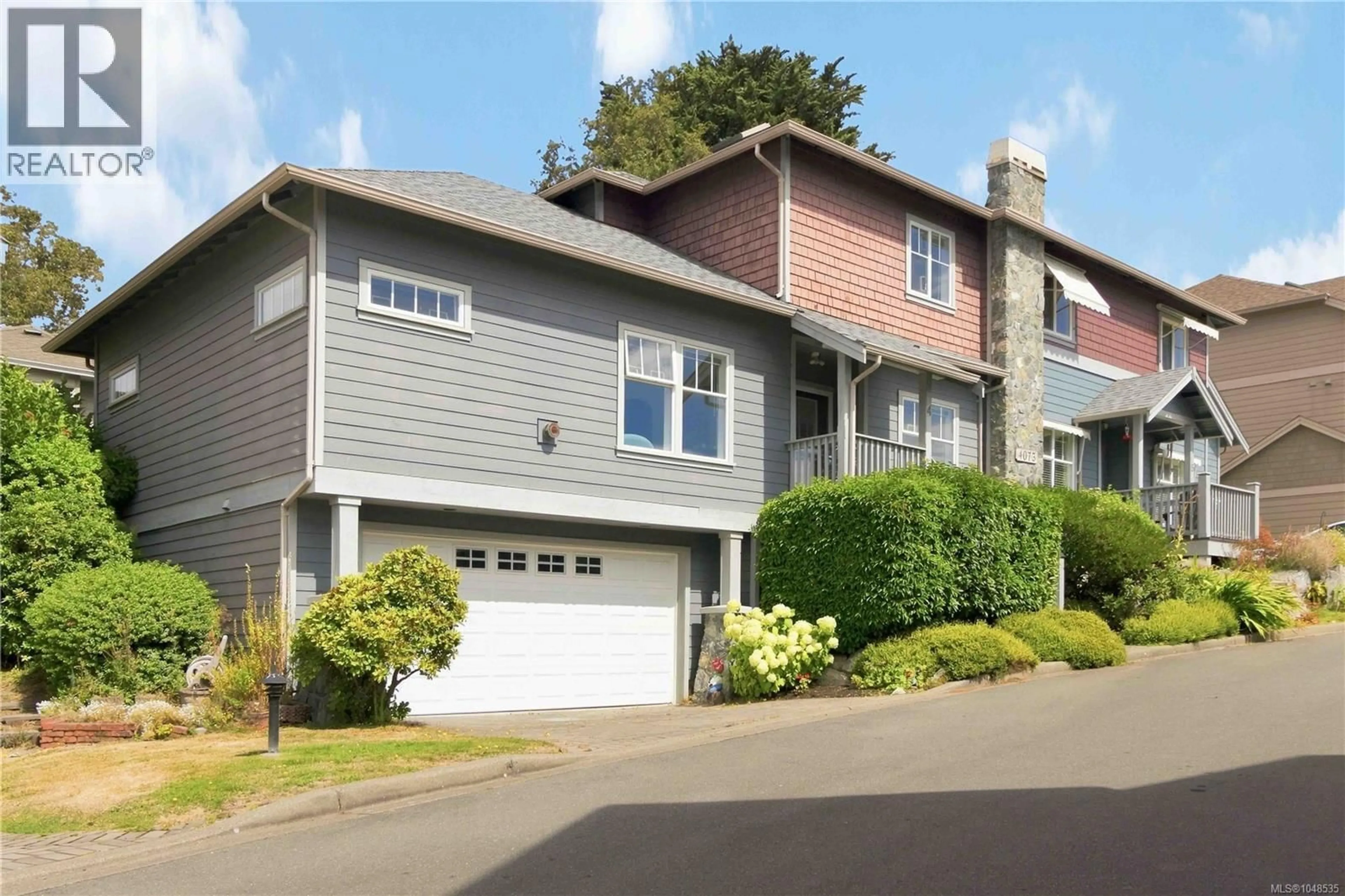 Home with vinyl exterior material, street for 4 - 4073 BLACKBERRY LANE, Saanich British Columbia V8X5J5