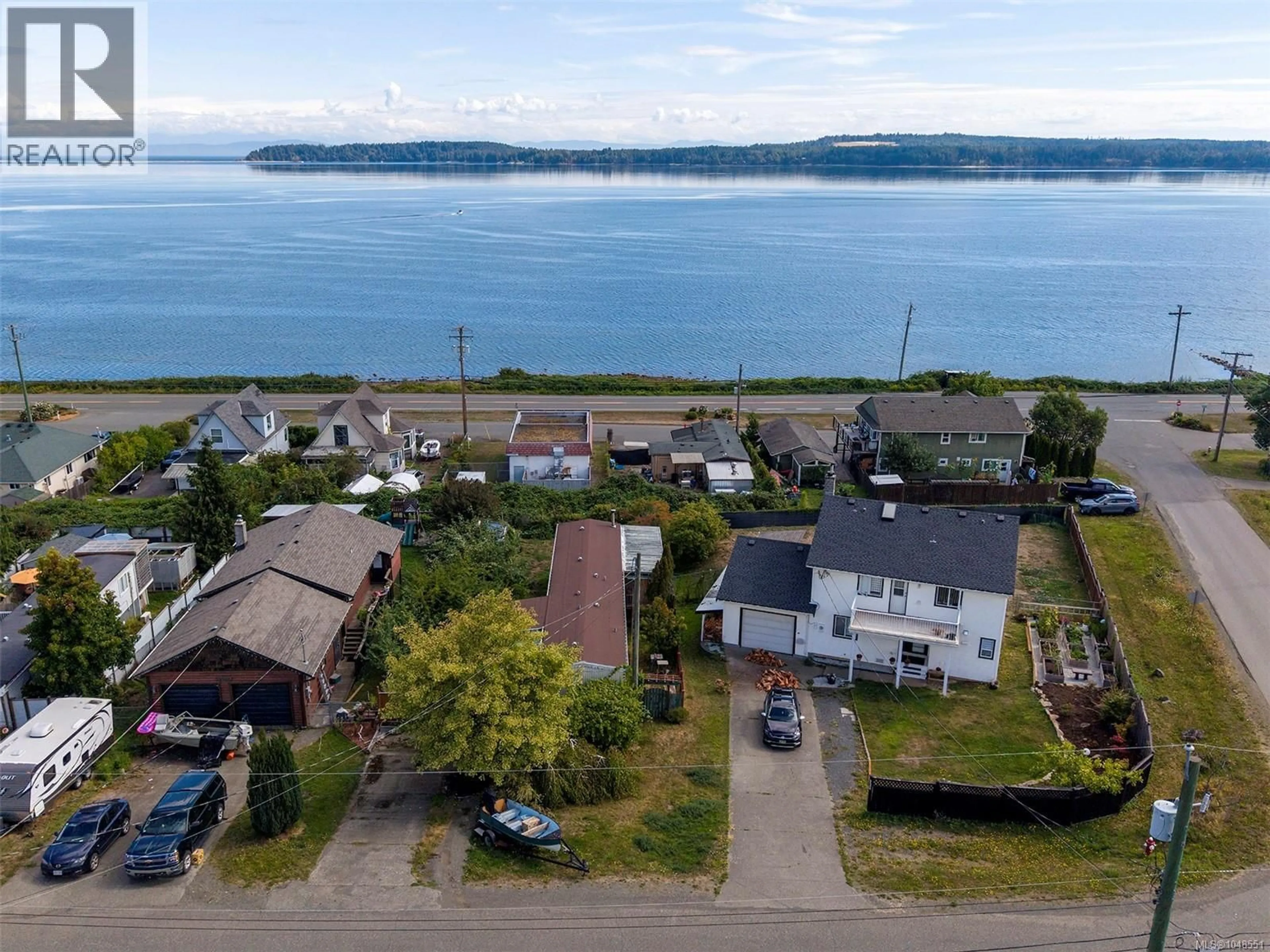 A pic from outside/outdoor area/front of a property/back of a property/a pic from drone, water/lake/river/ocean view for 5580 HORNE STREET, Union Bay British Columbia V0R3B0