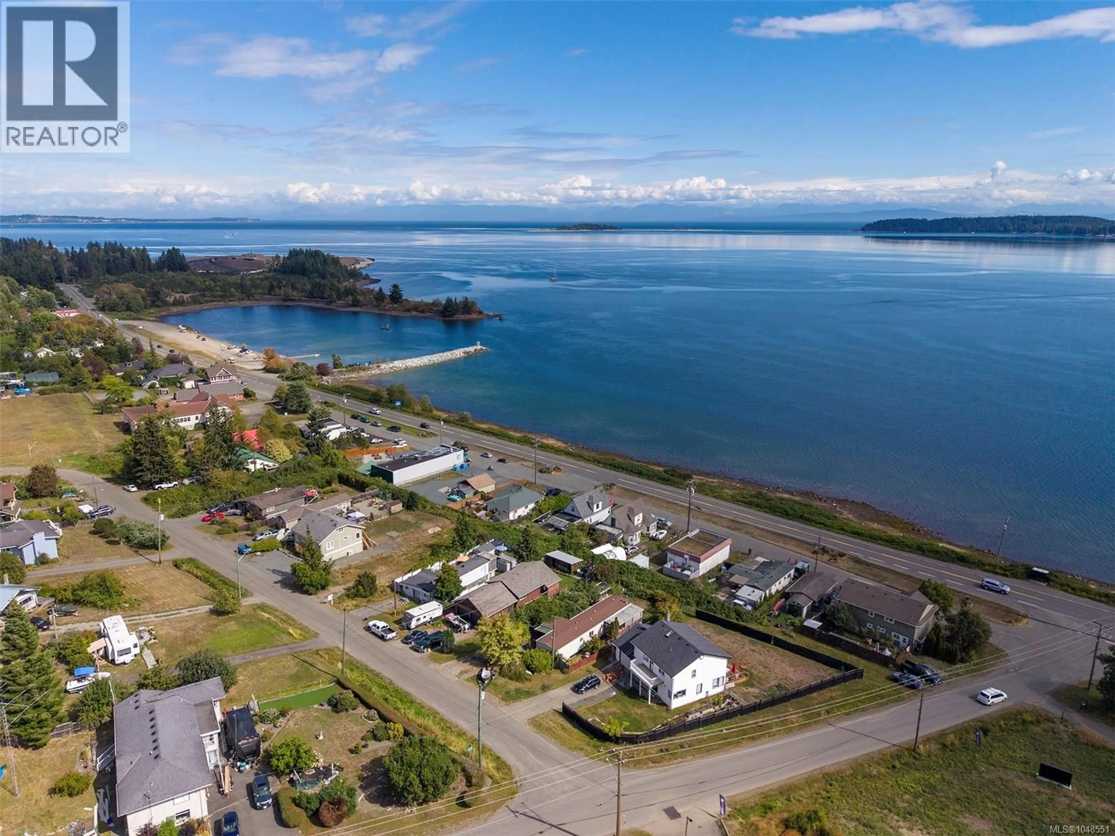 A pic from outside/outdoor area/front of a property/back of a property/a pic from drone, water/lake/river/ocean view for 5580 HORNE STREET, Union Bay British Columbia V0R3B0