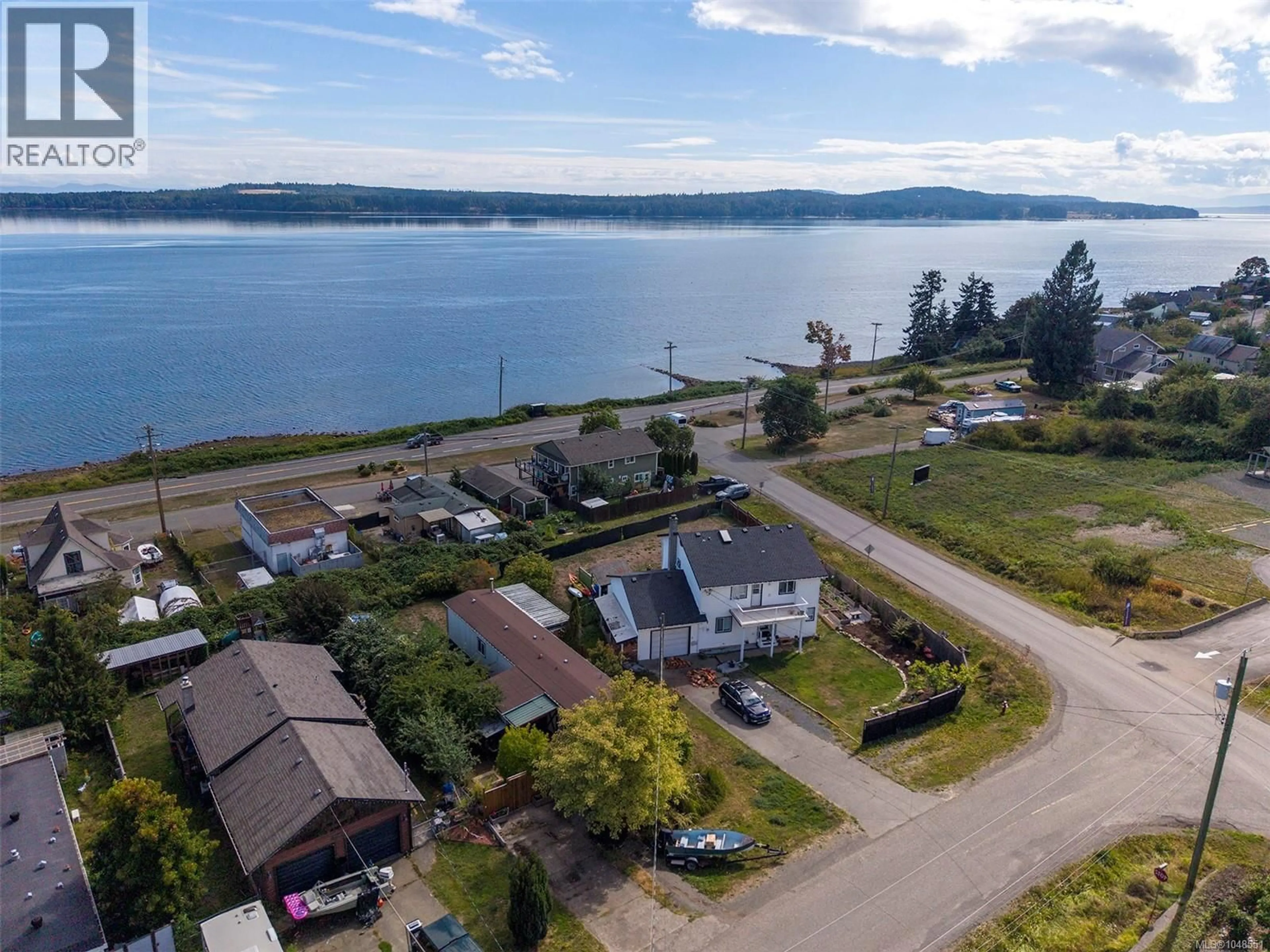 A pic from outside/outdoor area/front of a property/back of a property/a pic from drone, water/lake/river/ocean view for 5580 HORNE STREET, Union Bay British Columbia V0R3B0
