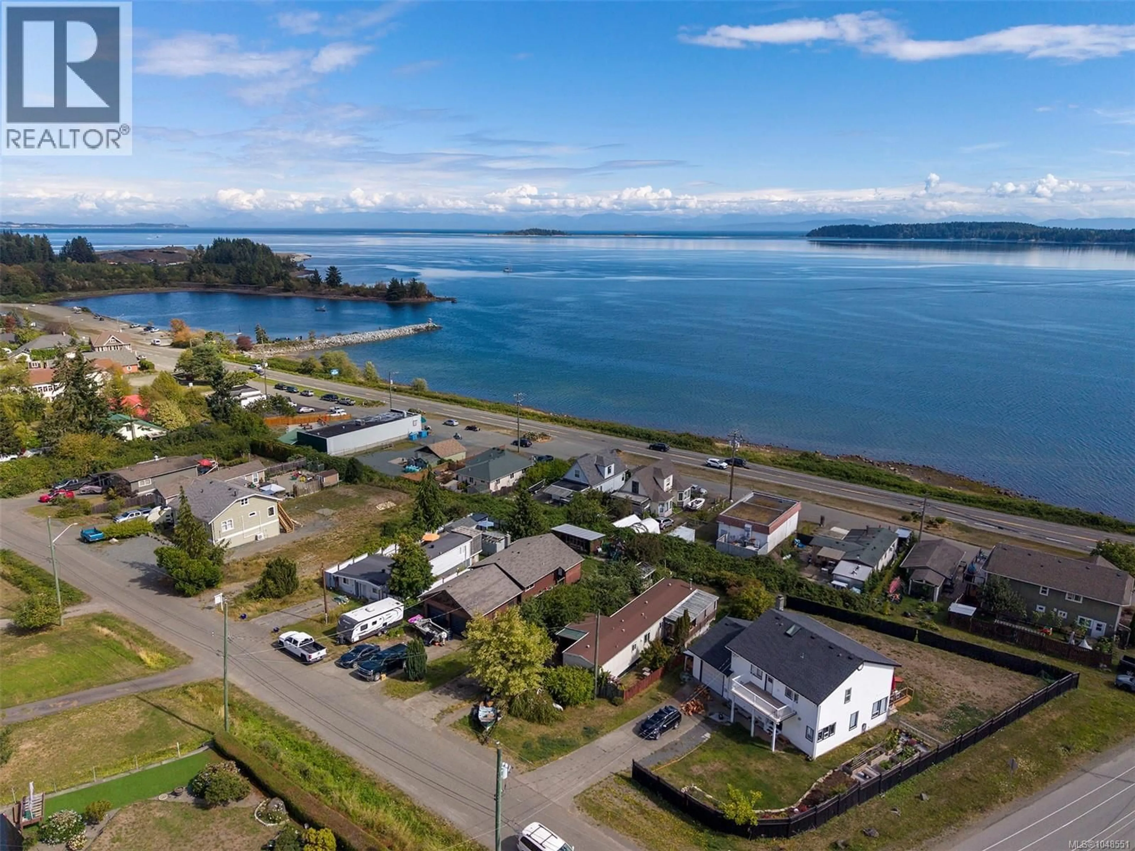 A pic from outside/outdoor area/front of a property/back of a property/a pic from drone, water/lake/river/ocean view for 5580 HORNE STREET, Union Bay British Columbia V0R3B0