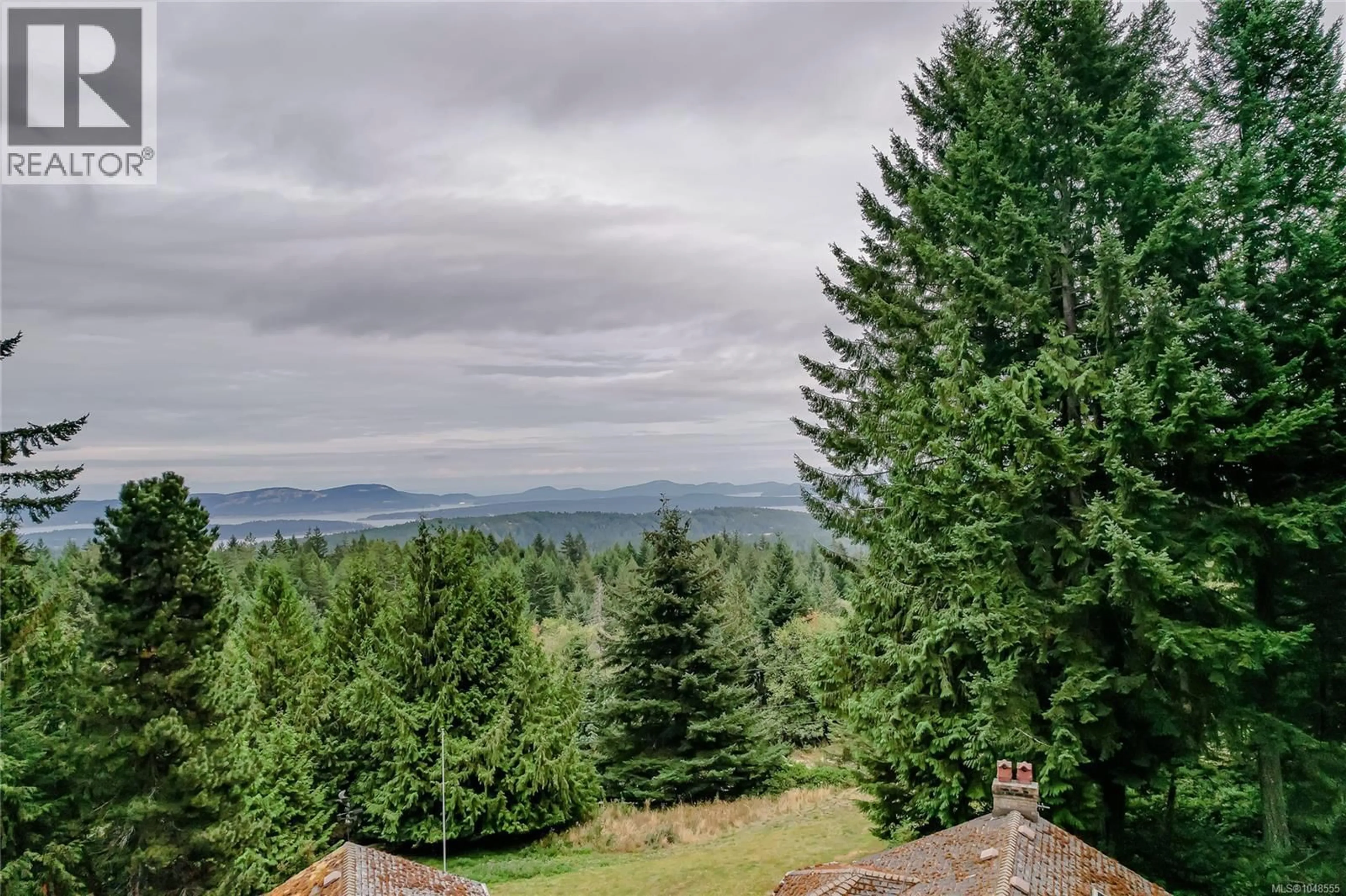A pic from outside/outdoor area/front of a property/back of a property/a pic from drone, forest/trees view for 190 SEYMOUR HEIGHTS, Salt Spring British Columbia V8K2B6