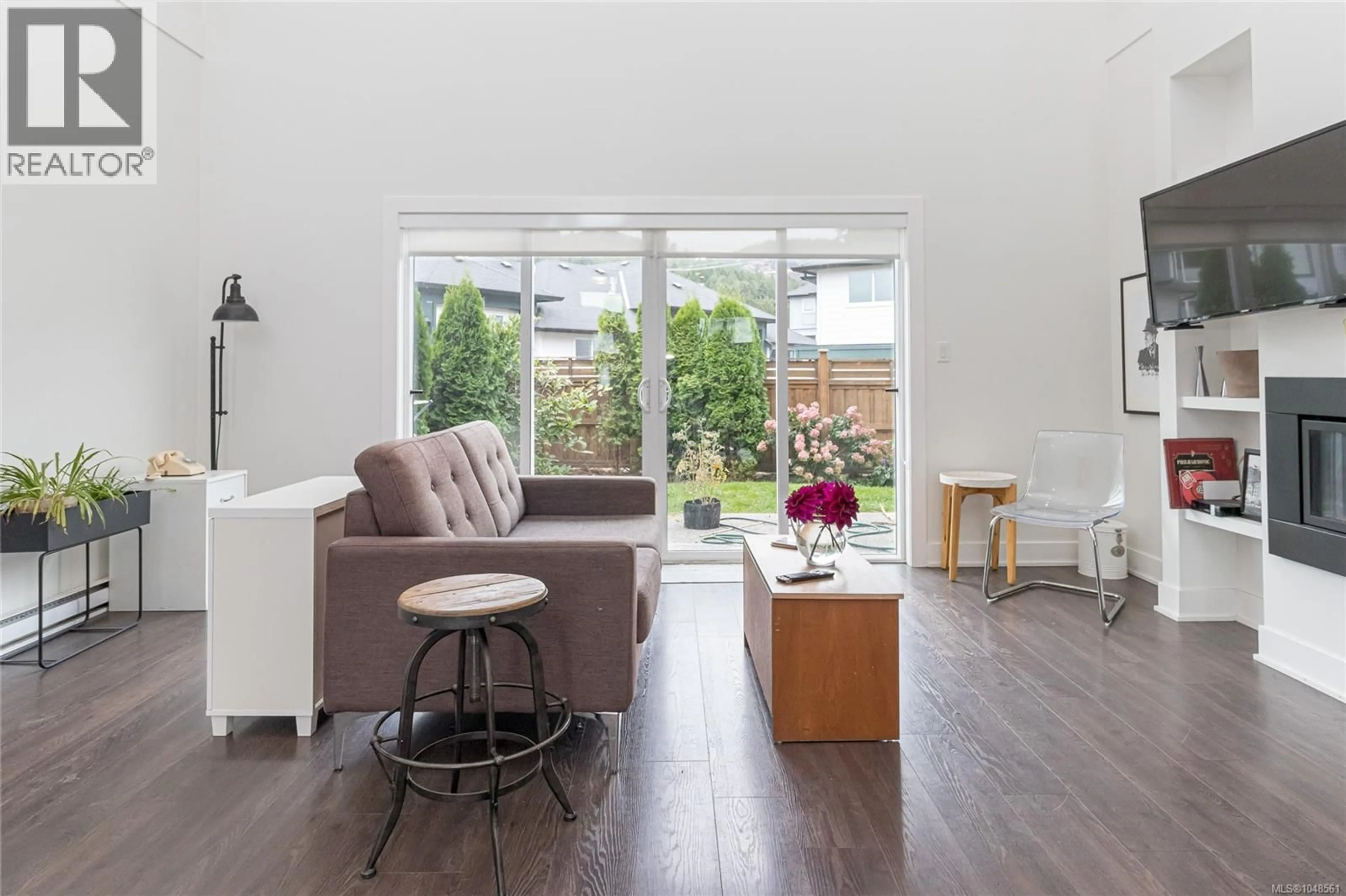 Living room with furniture, wood/laminate floor for 2874 MERIDIAN AVENUE, Langford British Columbia V9B0V2