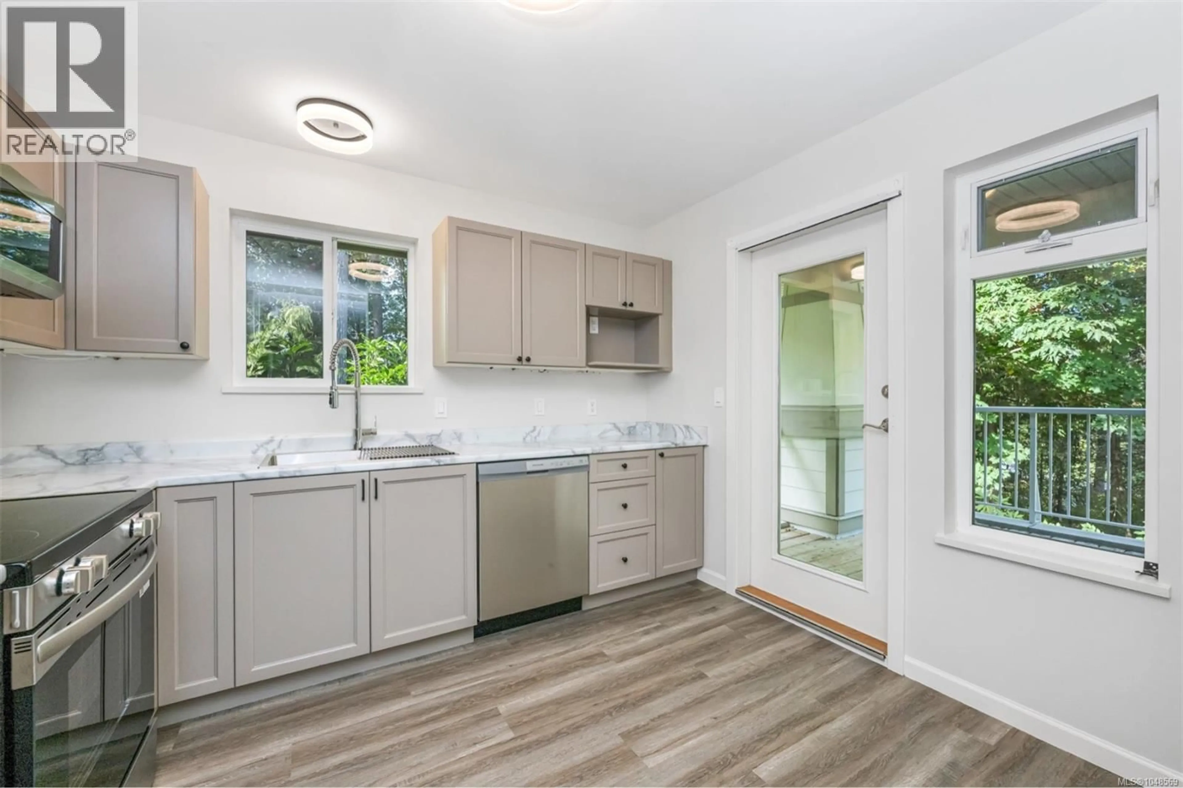 Open concept kitchen, ceramic/tile floor for 213 - 2777 BARRY ROAD, Mill Bay British Columbia V8H1K9