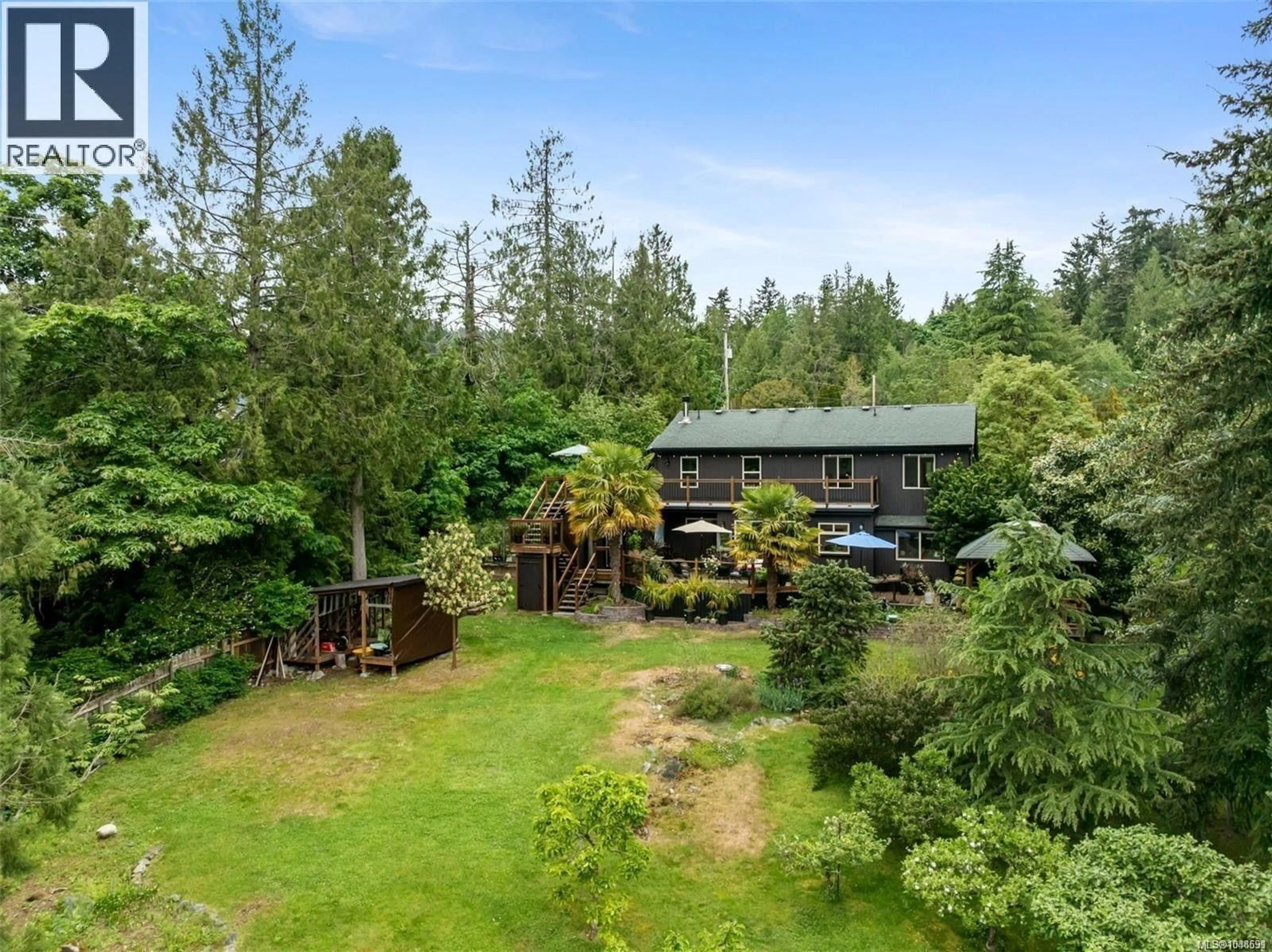 A pic from outside/outdoor area/front of a property/back of a property/a pic from drone, forest/trees view for 11007 CEDAR LANE, North Saanich British Columbia V8L5R1