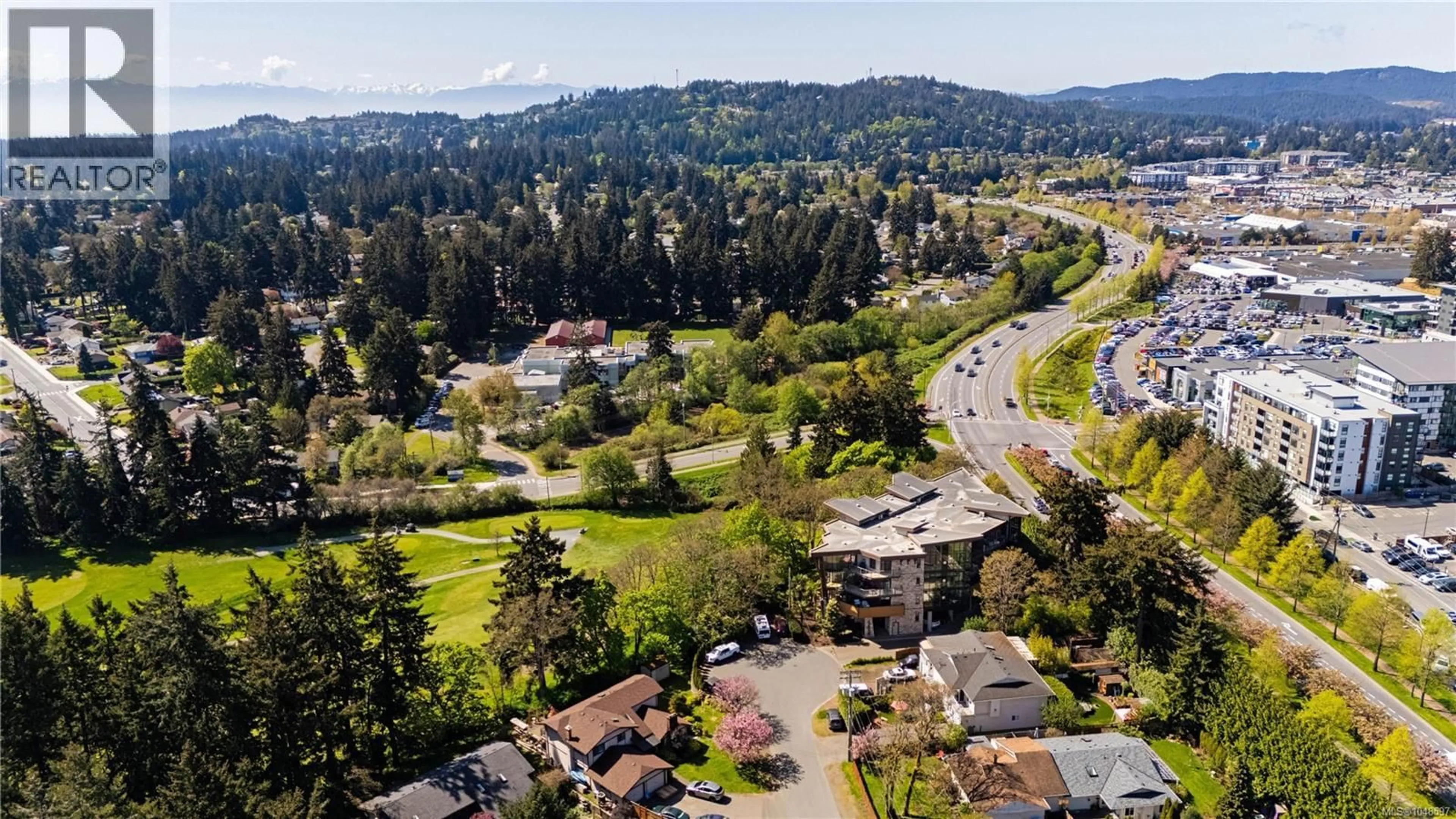 A pic from outside/outdoor area/front of a property/back of a property/a pic from drone, mountain view for 402 - 2850 ALDWYND ROAD, Langford British Columbia V9B3S7