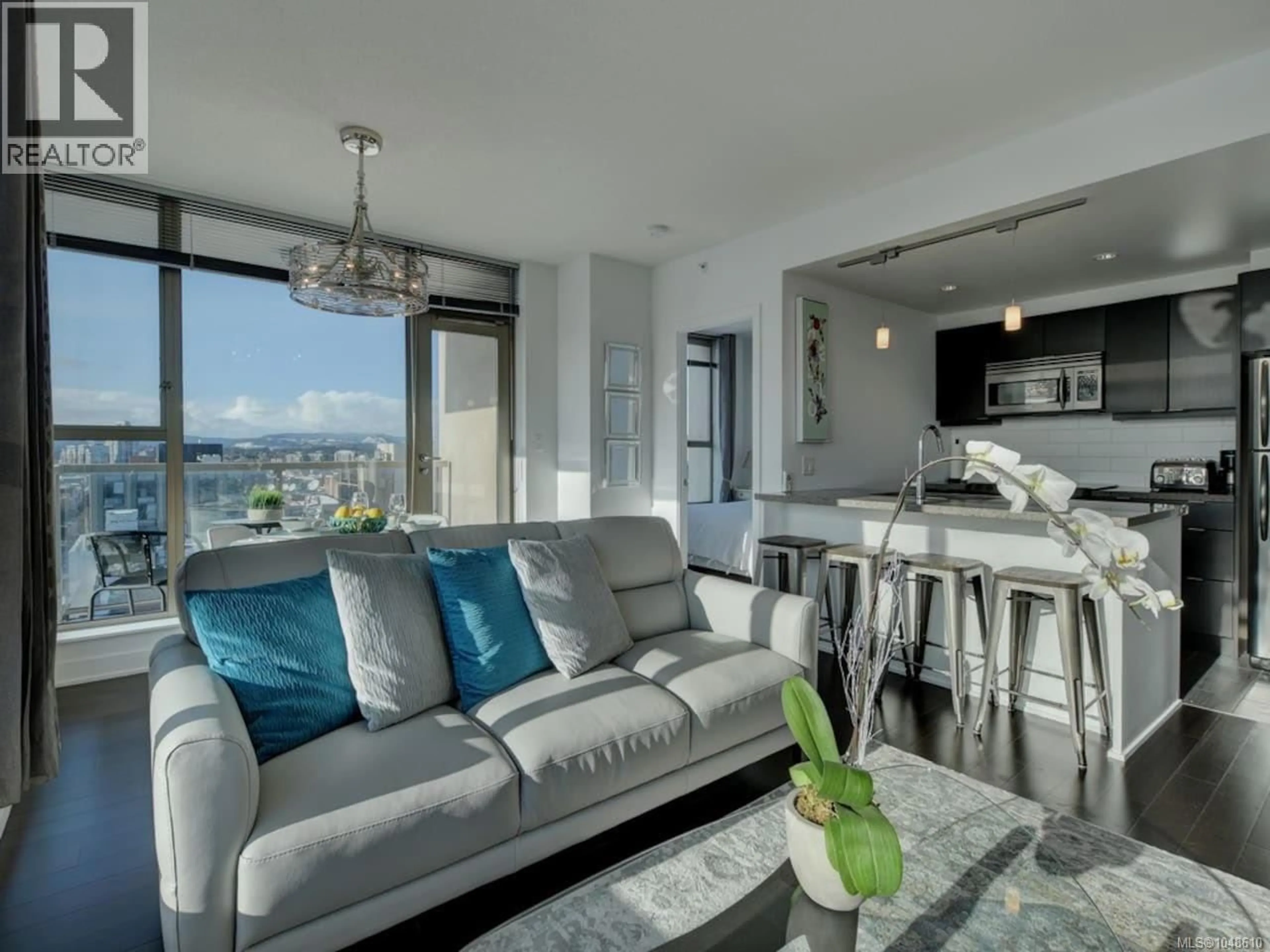 Living room with furniture, cement floor for 902 - 760 JOHNSON STREET, Victoria British Columbia V8W1N1