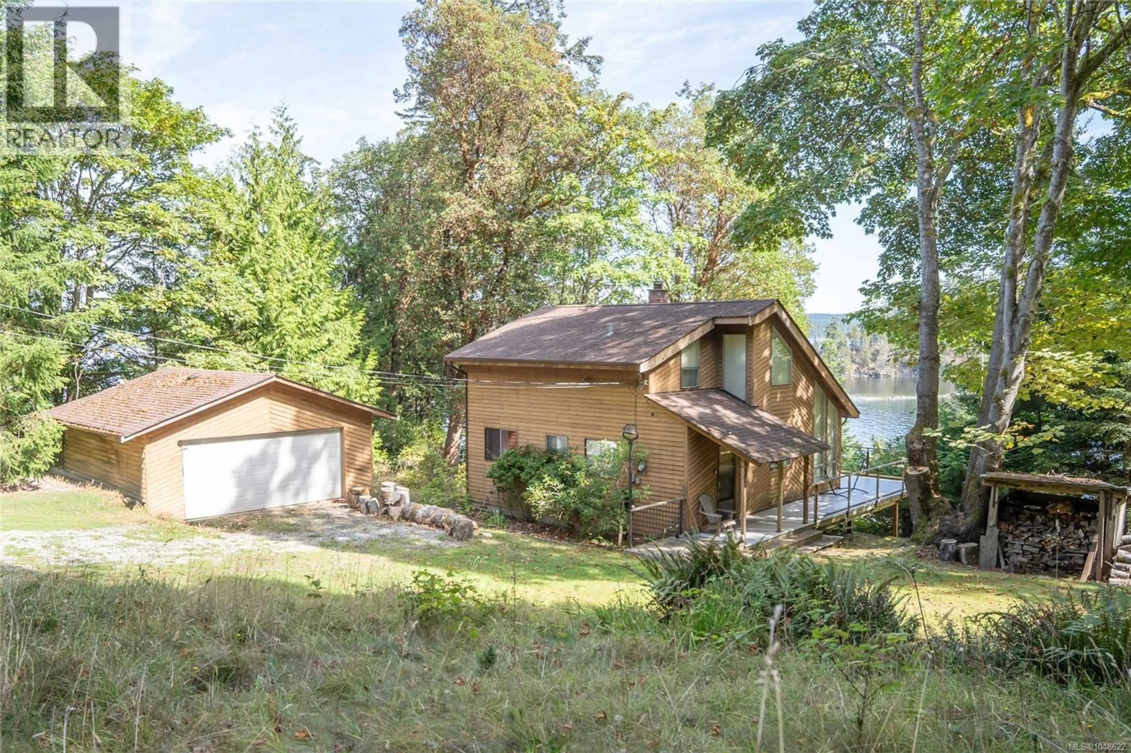 A pic from outside/outdoor area/front of a property/back of a property/a pic from drone, water/lake/river/ocean view for 124 CLAM BAY ROAD, Thetis Island British Columbia V0R2Y0
