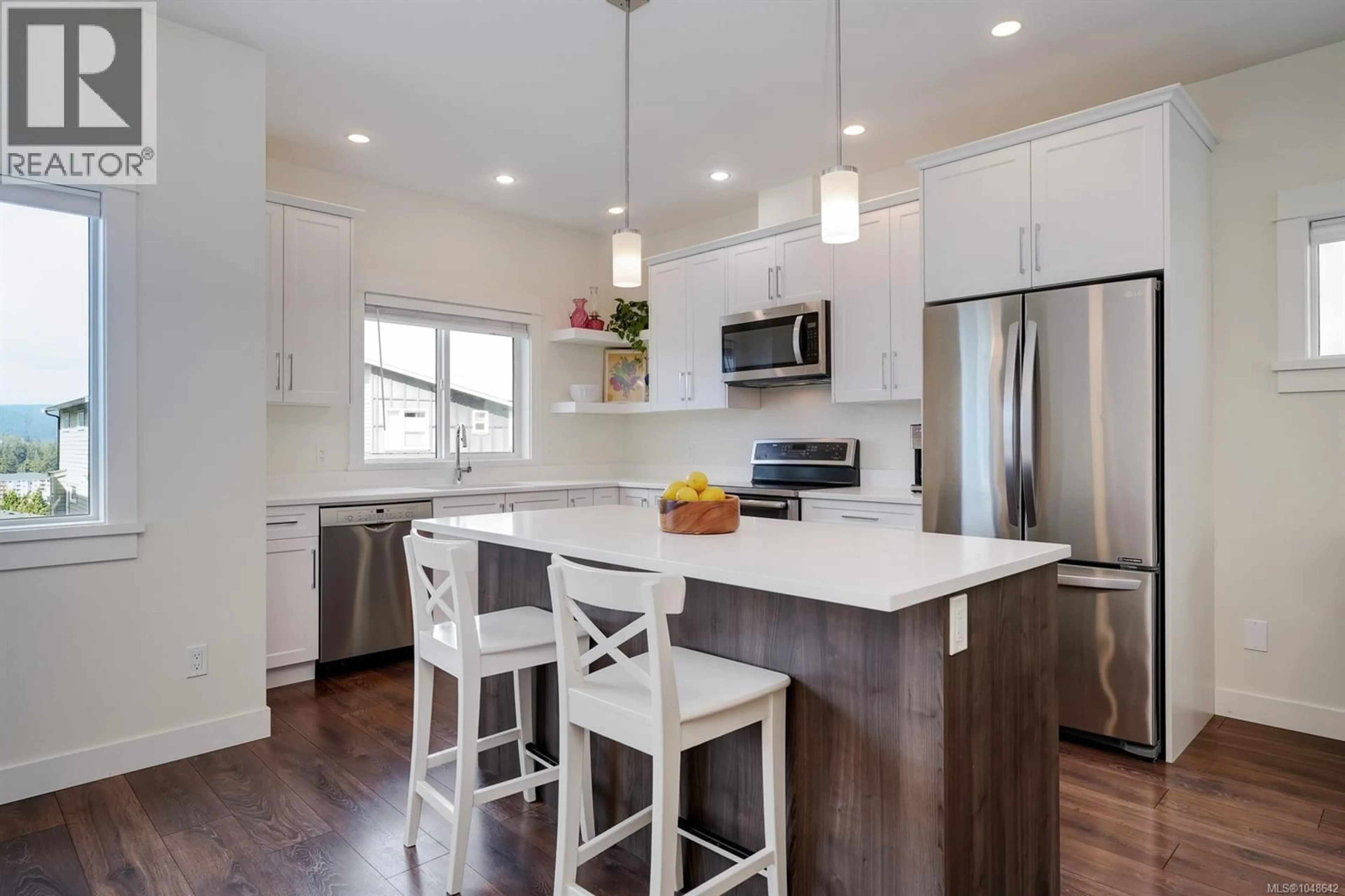 Open concept kitchen, wood/laminate floor for 3492 MYLES MANSELL ROAD, Langford British Columbia V9C0N6