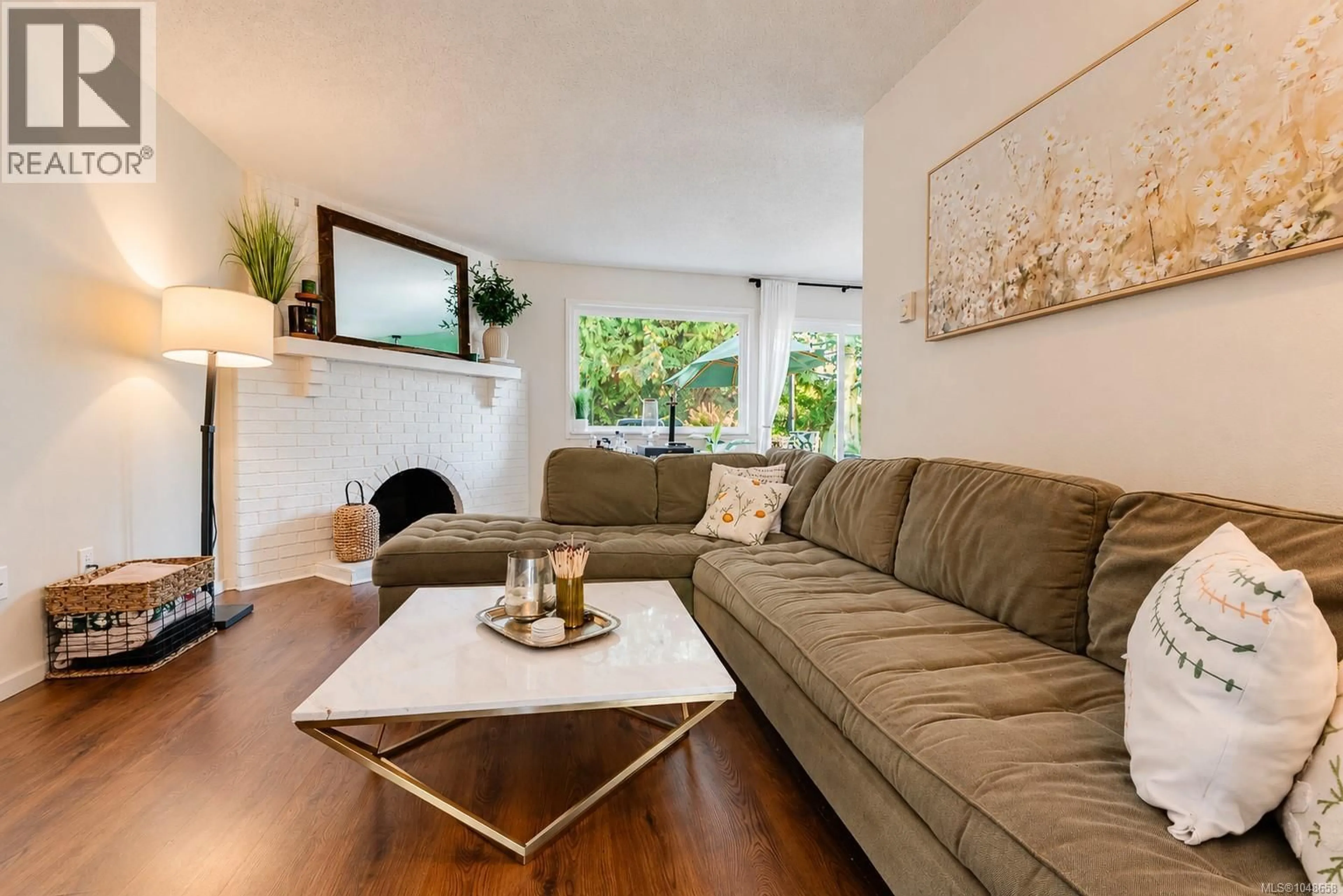 Living room with furniture, wood/laminate floor for 3035 METCHOSIN ROAD, Colwood British Columbia V9B4Y6