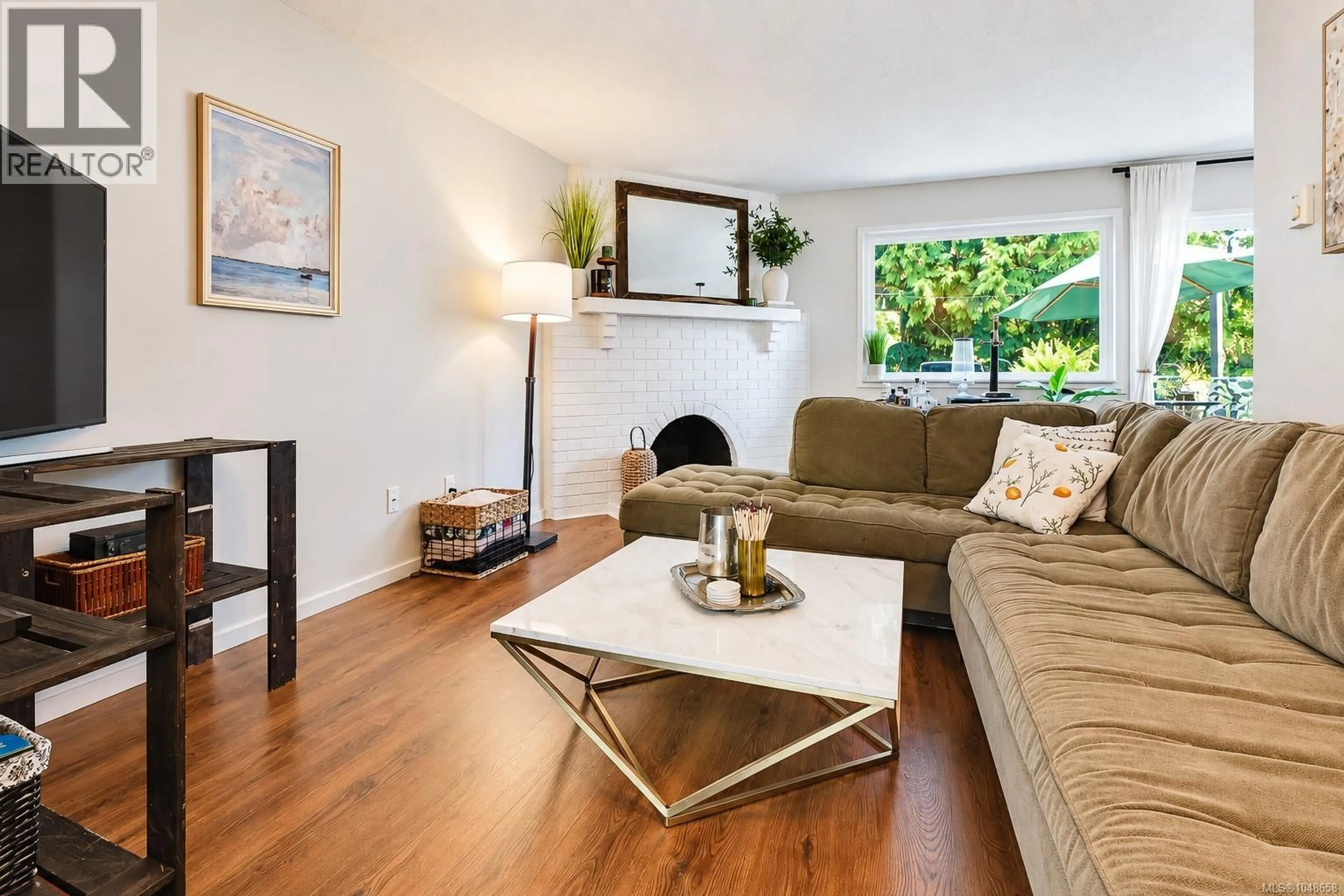 Living room with furniture, wood/laminate floor for 3035 METCHOSIN ROAD, Colwood British Columbia V9B4Y6