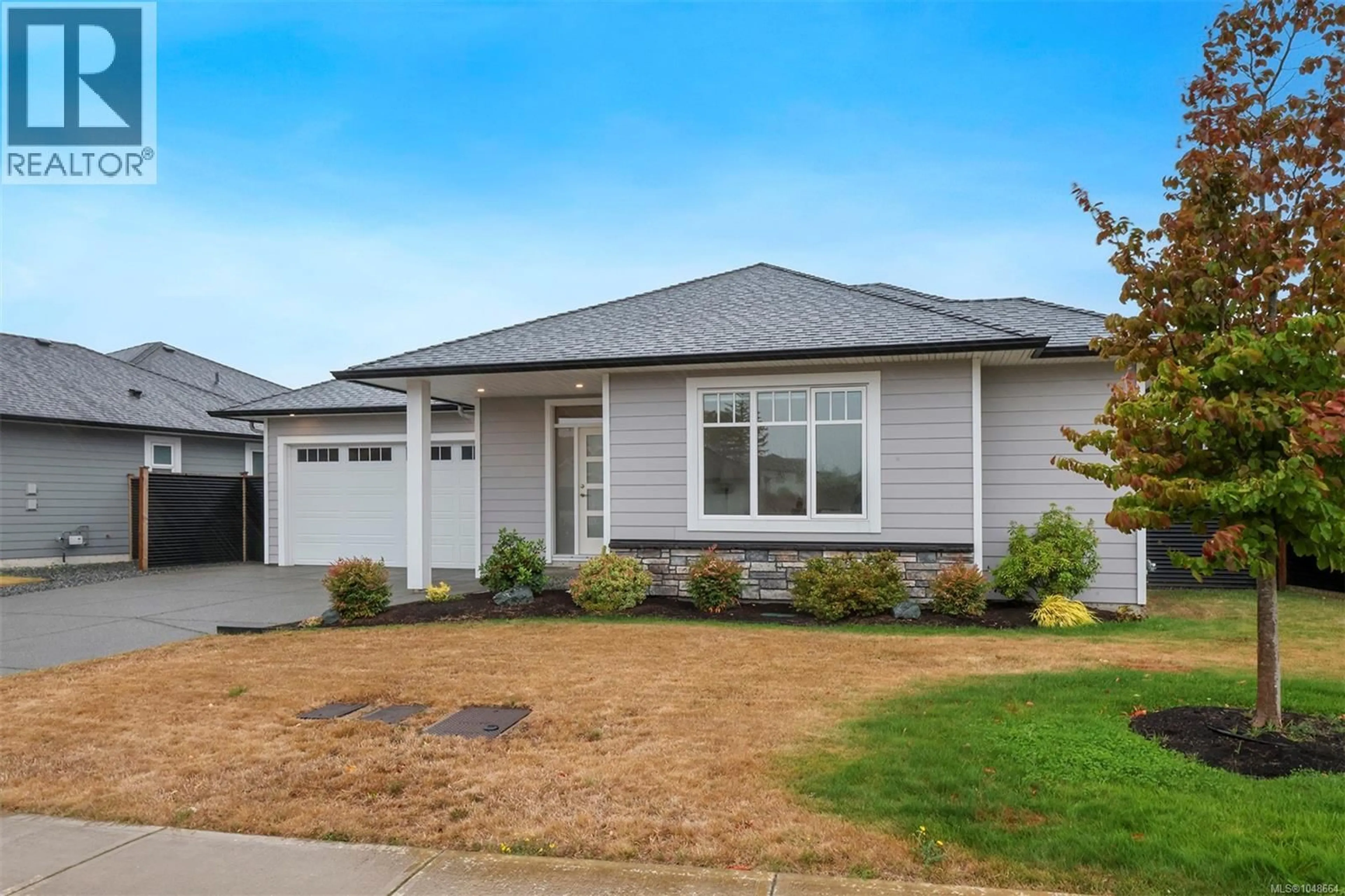 Home with vinyl exterior material, street for 859 LABRADOR DRIVE, Comox British Columbia V9M0C8