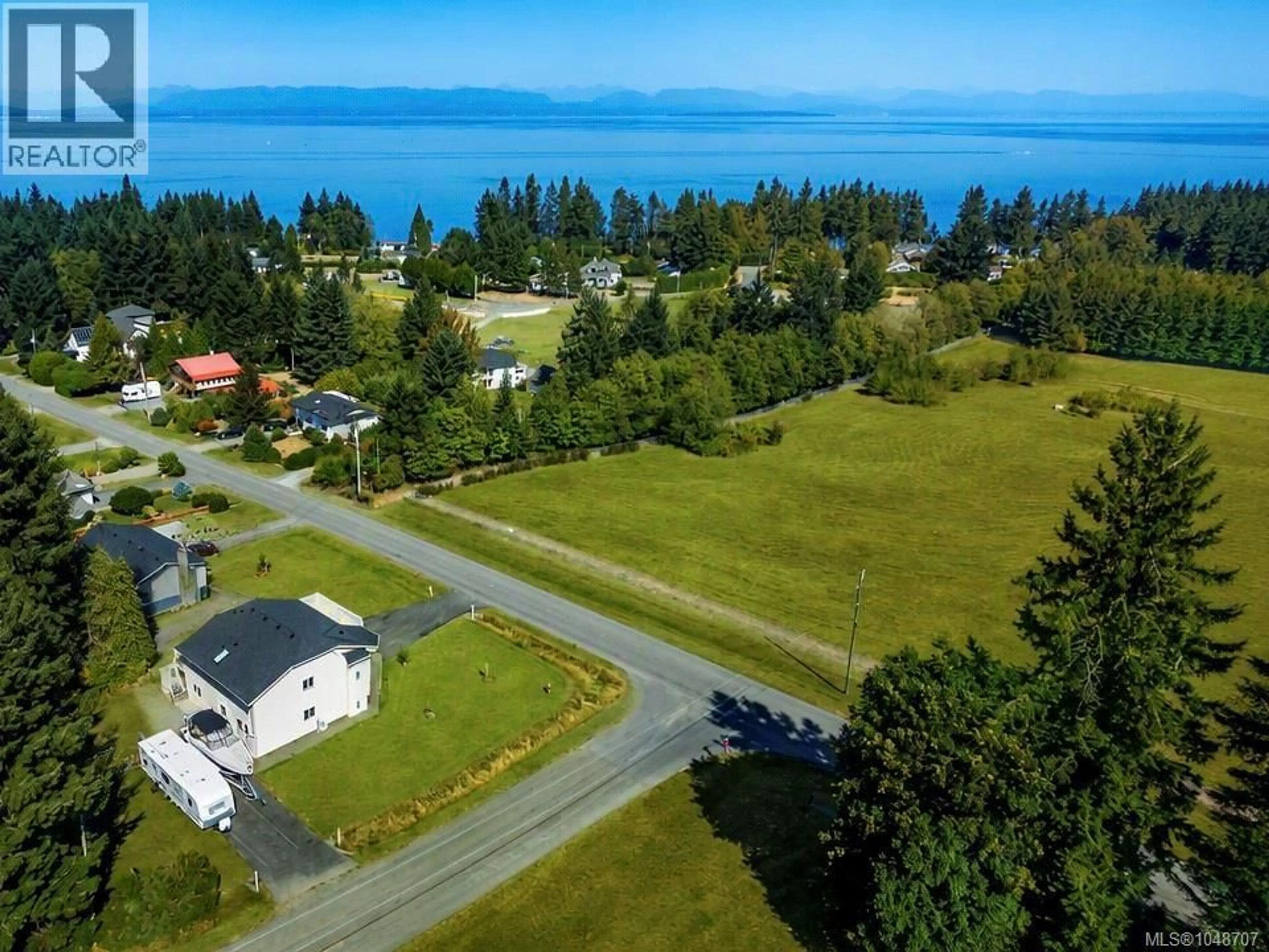 A pic from outside/outdoor area/front of a property/back of a property/a pic from drone, water/lake/river/ocean view for 2207 JUNE ROAD, Courtenay British Columbia V9J1X9