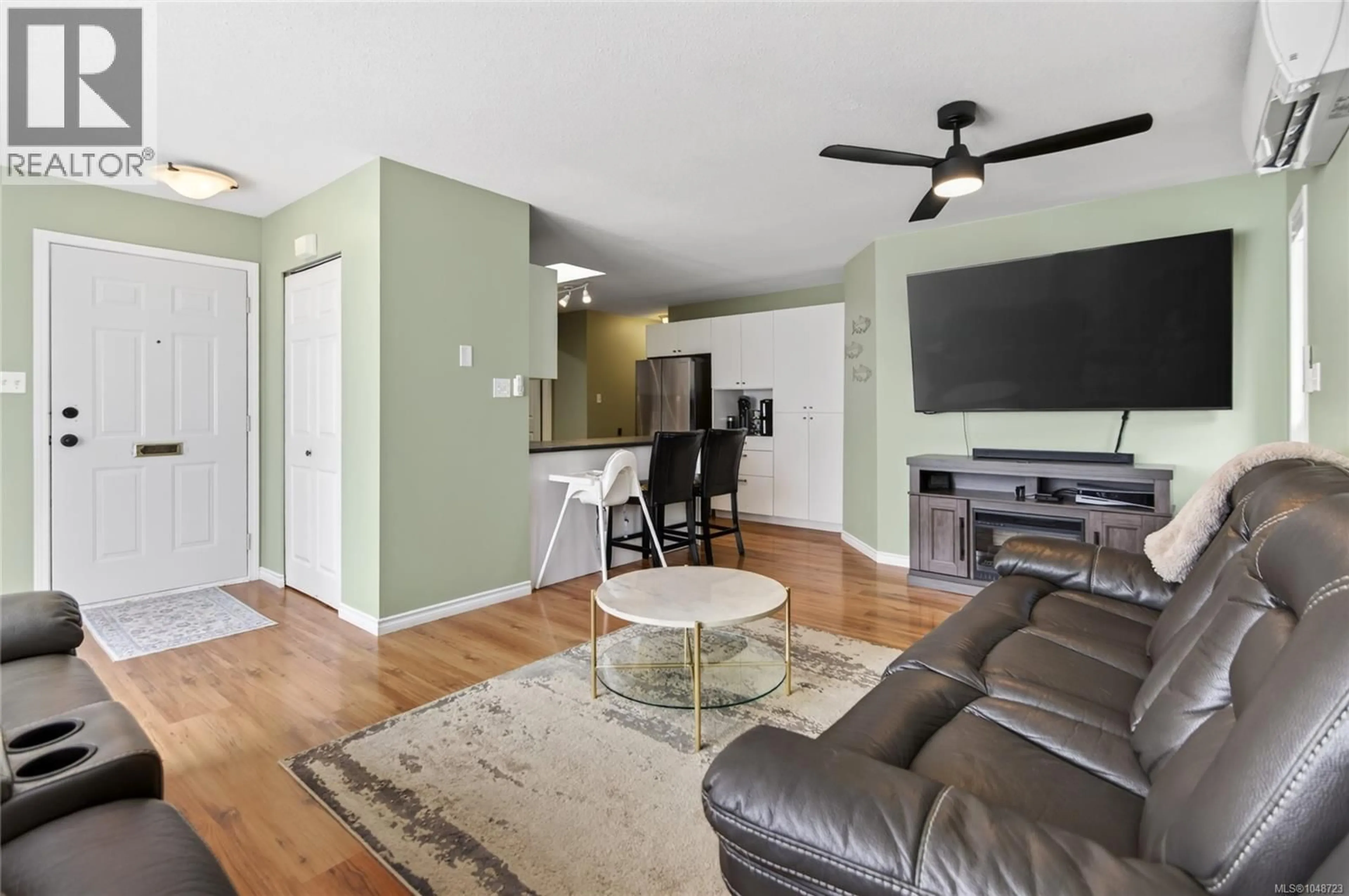 Living room with furniture, wood/laminate floor for A - 708 ERICKSON ROAD, Campbell River British Columbia V9W5N9