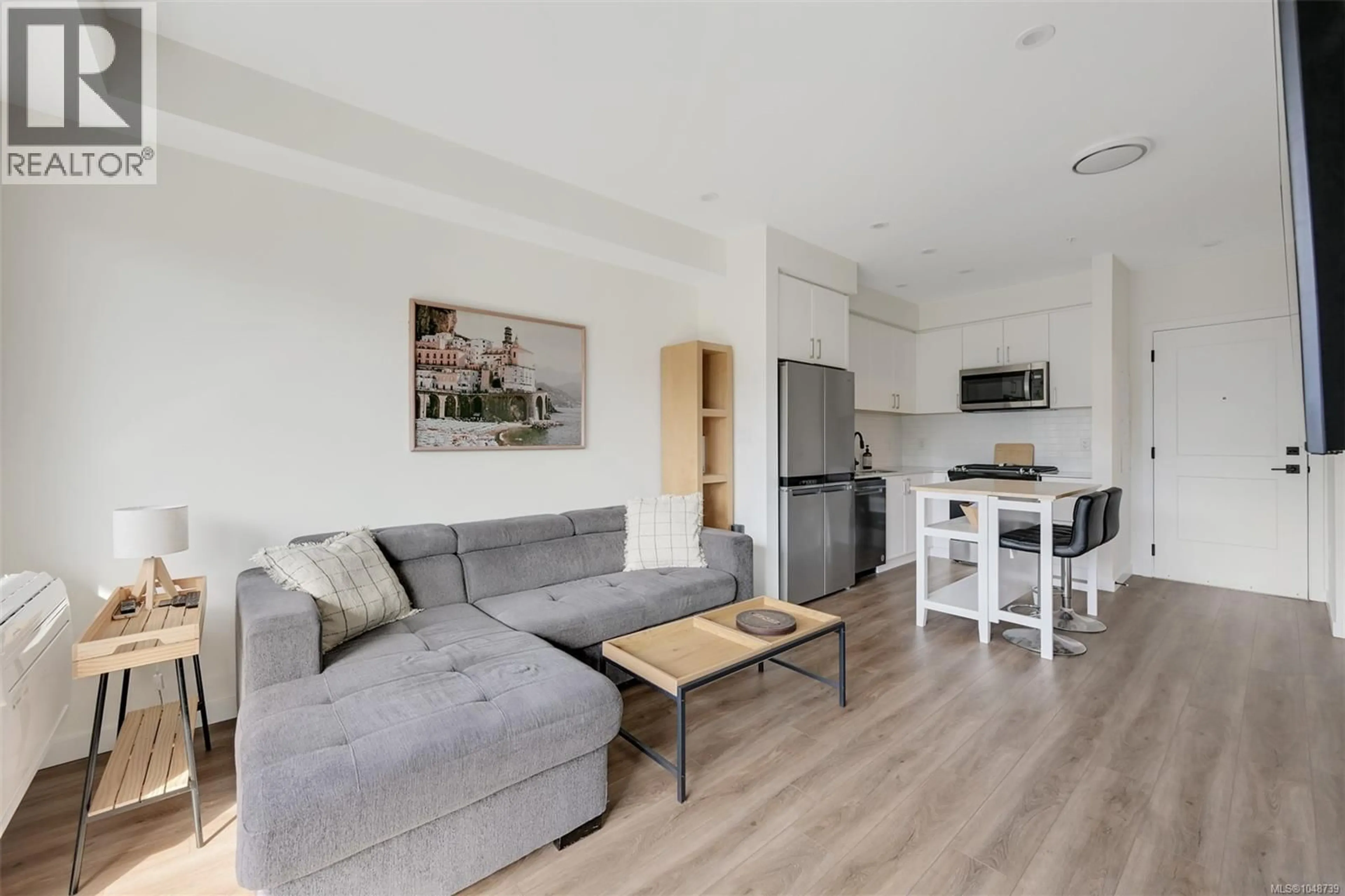 Living room with furniture, wood/laminate floor for 407 - 654 GRANDERSON ROAD, Langford British Columbia V9B7B9