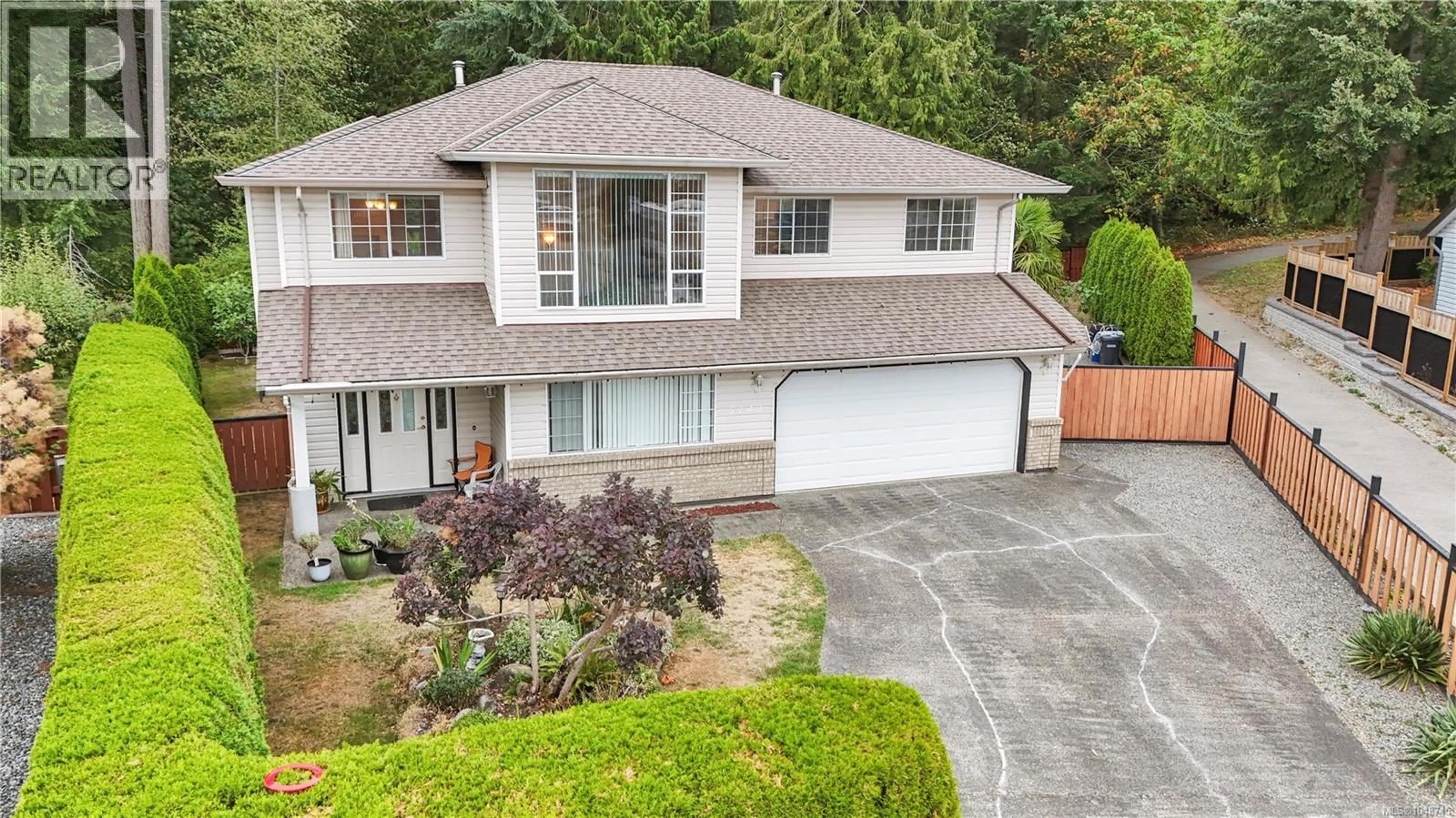 A pic from outside/outdoor area/front of a property/back of a property/a pic from drone, street for 5143 CAROL PLACE, Nanaimo British Columbia V9T5Z3