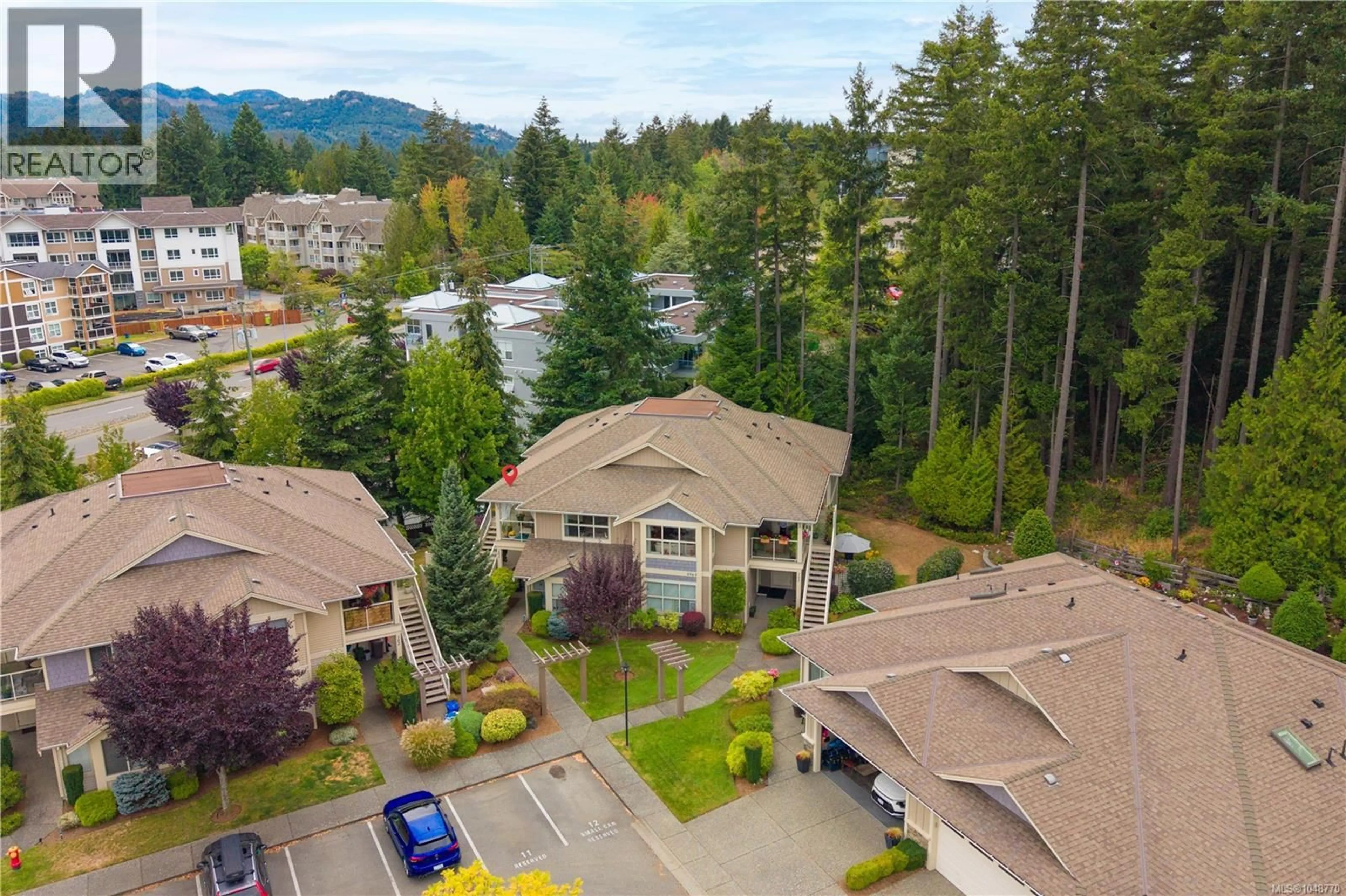 A pic from outside/outdoor area/front of a property/back of a property/a pic from drone, mountain view for 201 - 5965 KADEN PLACE, Nanaimo British Columbia V9T0B5