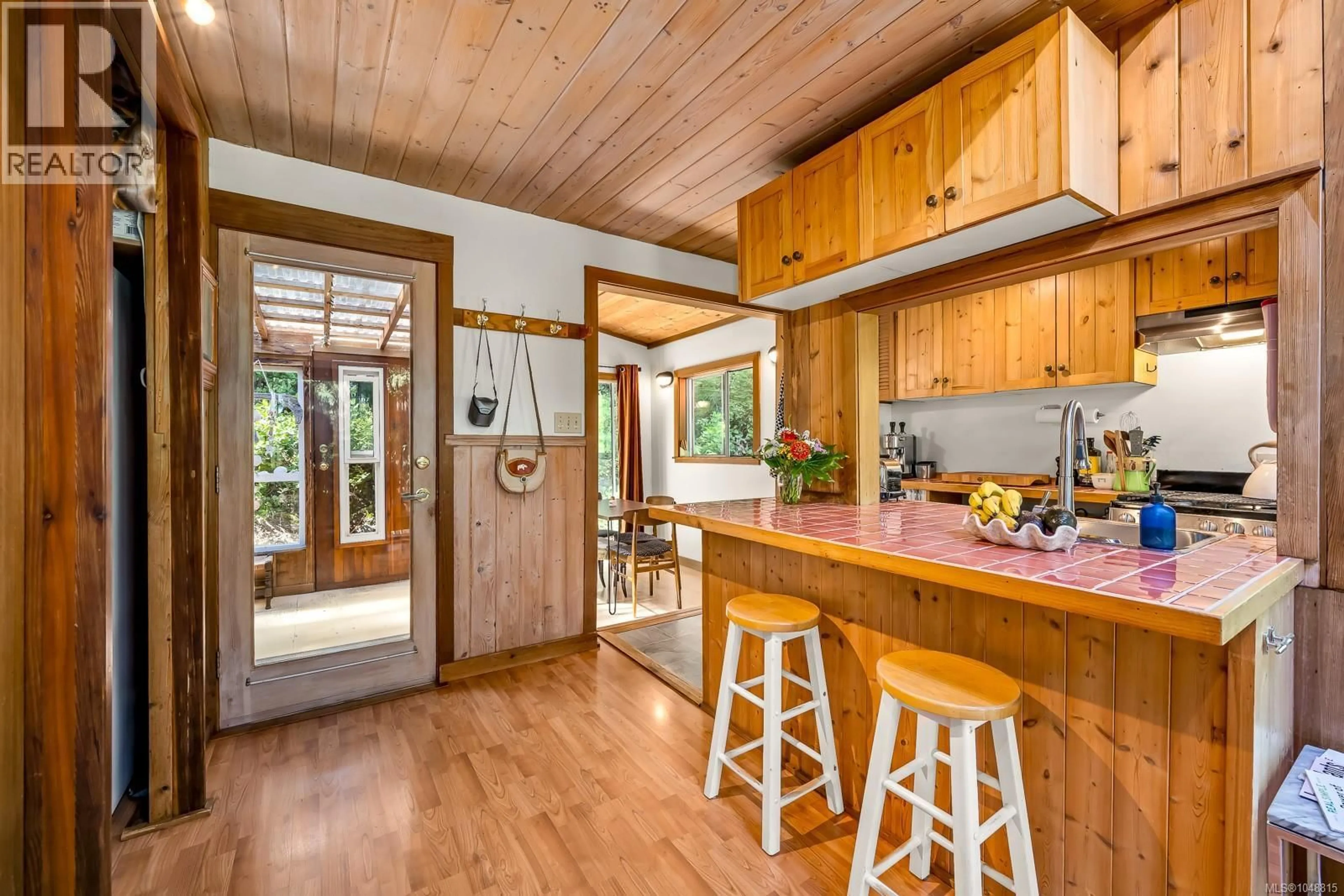 Rustic kitchen, wood/laminate floor for 838 SUTIL POINT ROAD, Cortes Island British Columbia V0P1K0