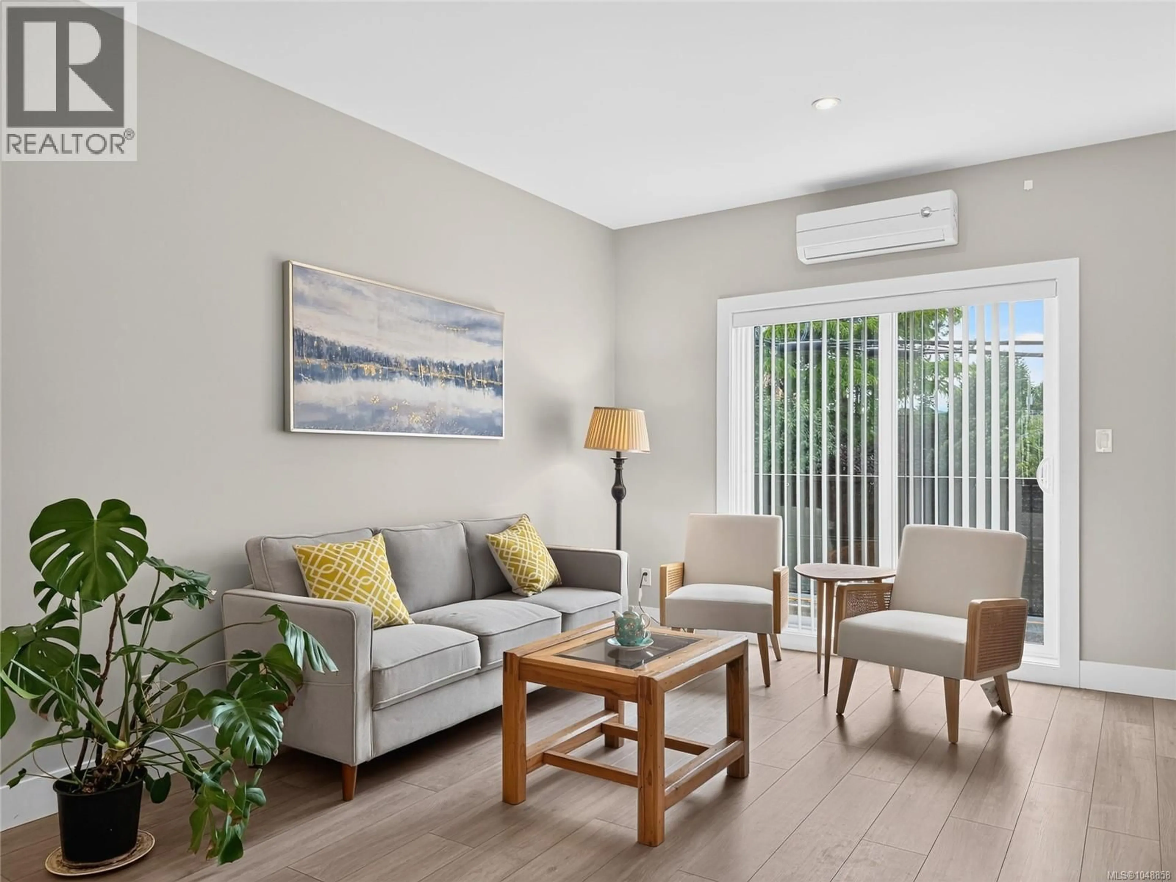 Living room with furniture, wood/laminate floor for 105 - 2821 JACKLIN ROAD, Langford British Columbia V9B0T3