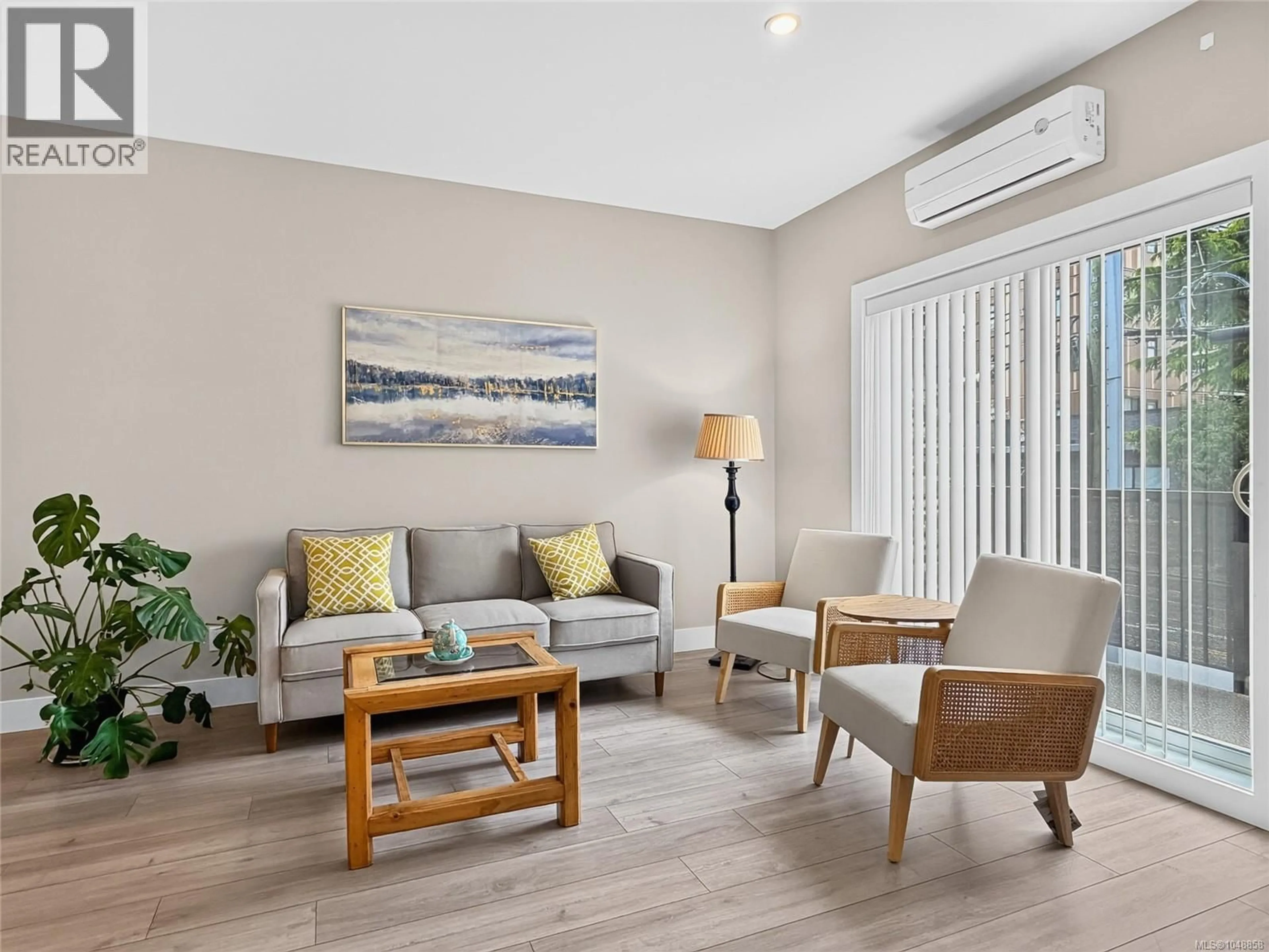 Living room with furniture, wood/laminate floor for 105 - 2821 JACKLIN ROAD, Langford British Columbia V9B0T3