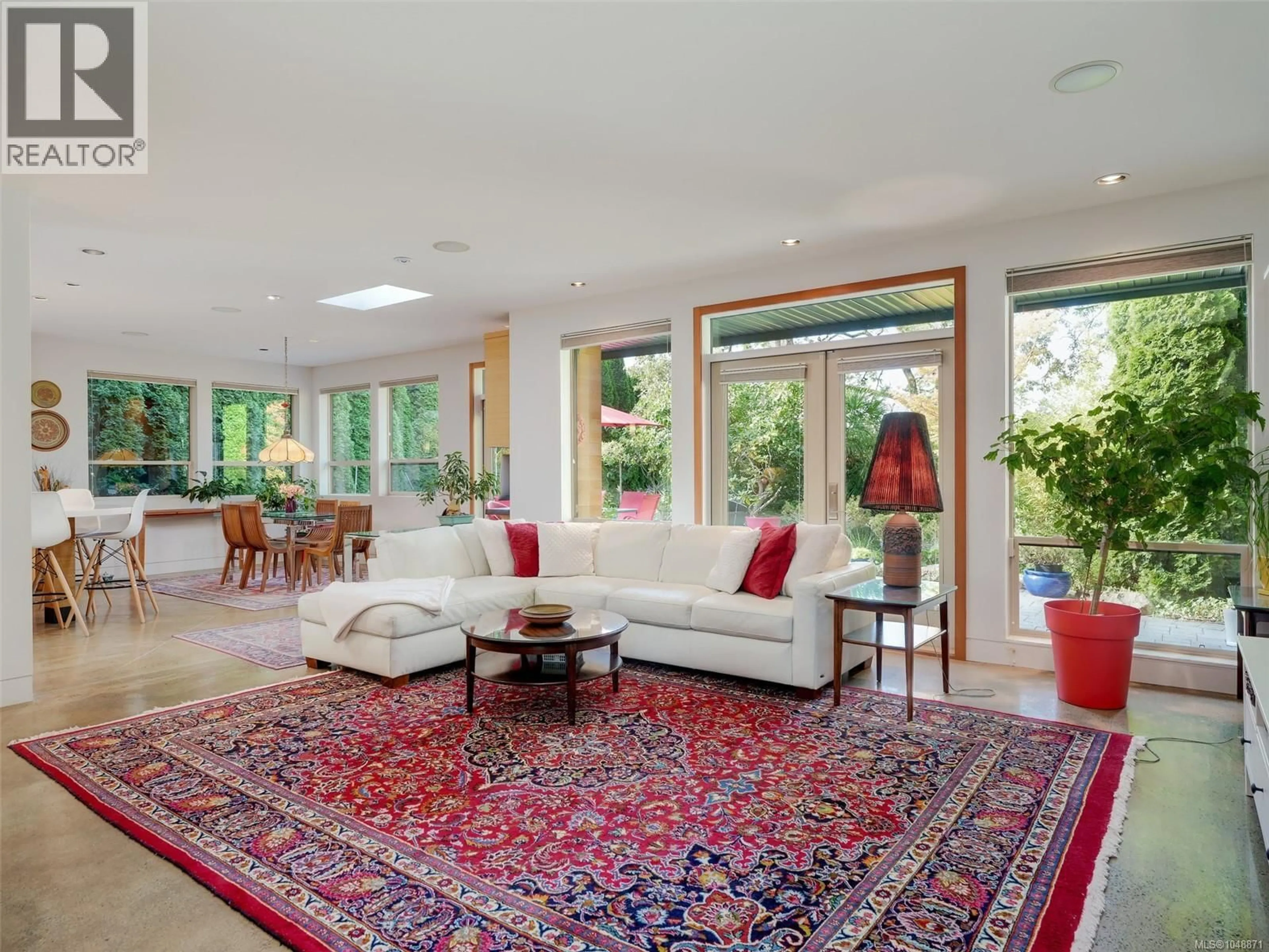 Living room with furniture, carpet floor for 1047 SAN MARINO CRESCENT, Saanich British Columbia V8X3B3