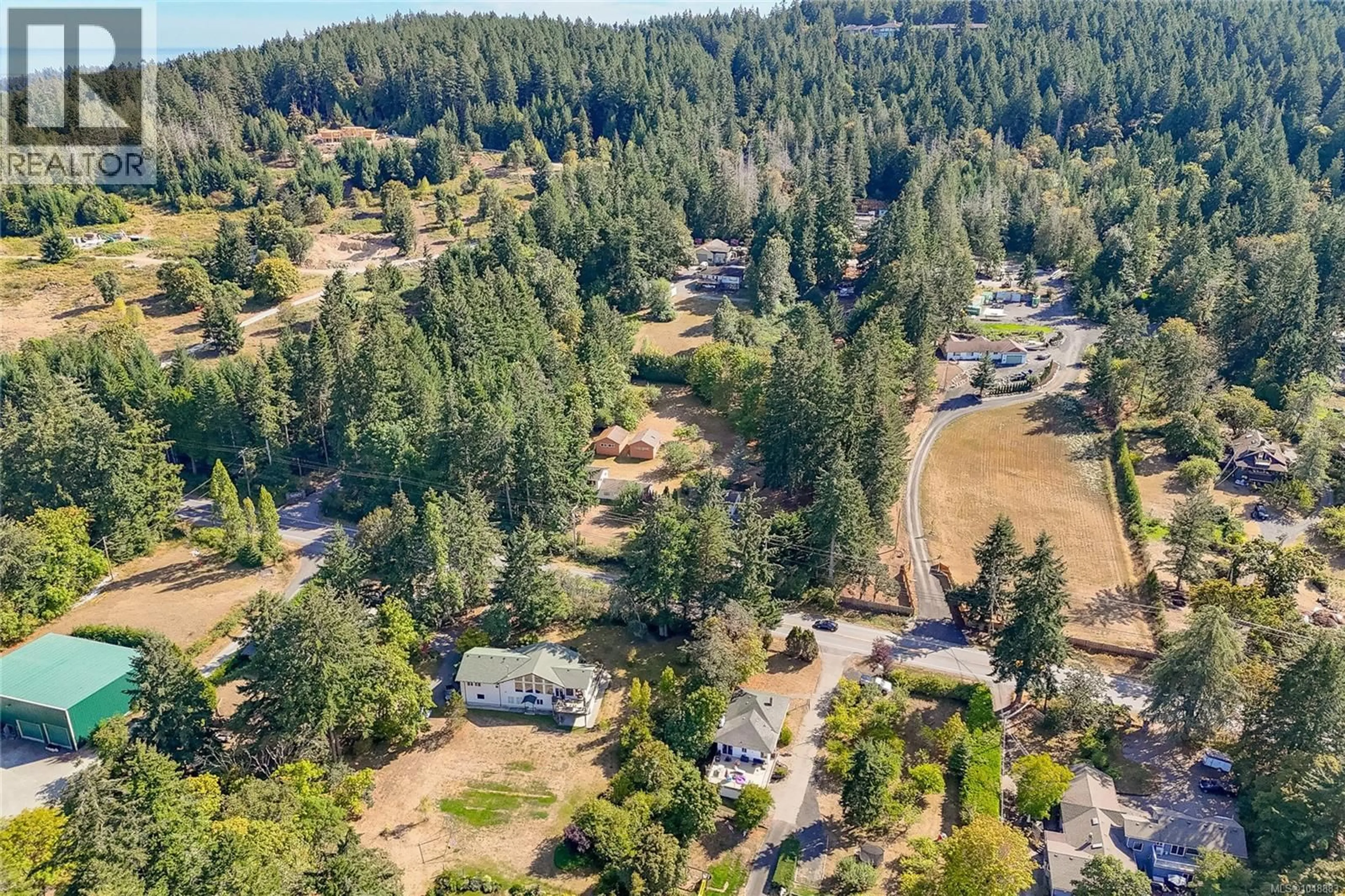 A pic from outside/outdoor area/front of a property/back of a property/a pic from drone, forest/trees view for 1475 MCTAVISH ROAD, North Saanich British Columbia V8L5T3