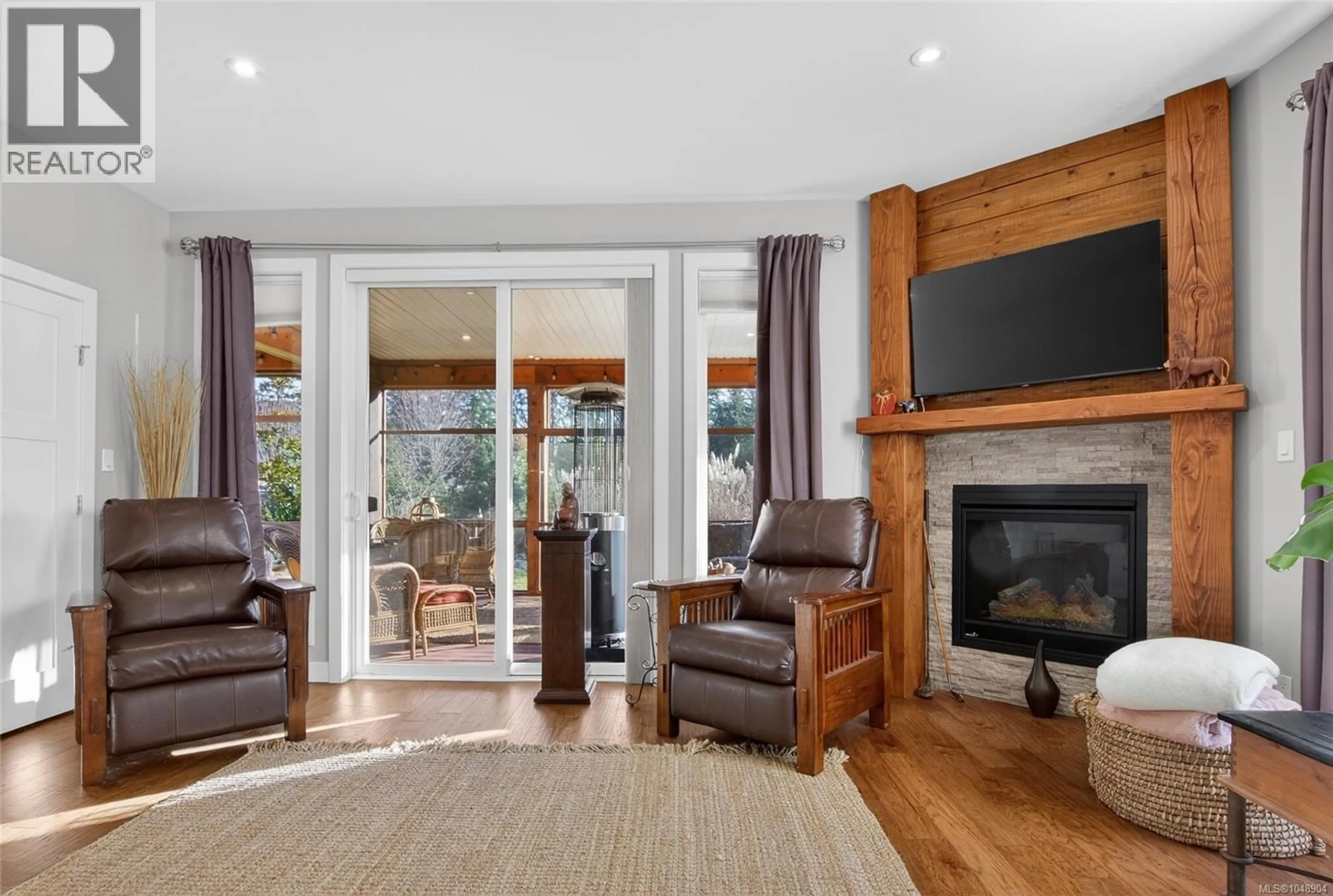 Living room with furniture, wood/laminate floor for 7284 LAKEFRONT DRIVE, Lake Cowichan British Columbia V0R2G1