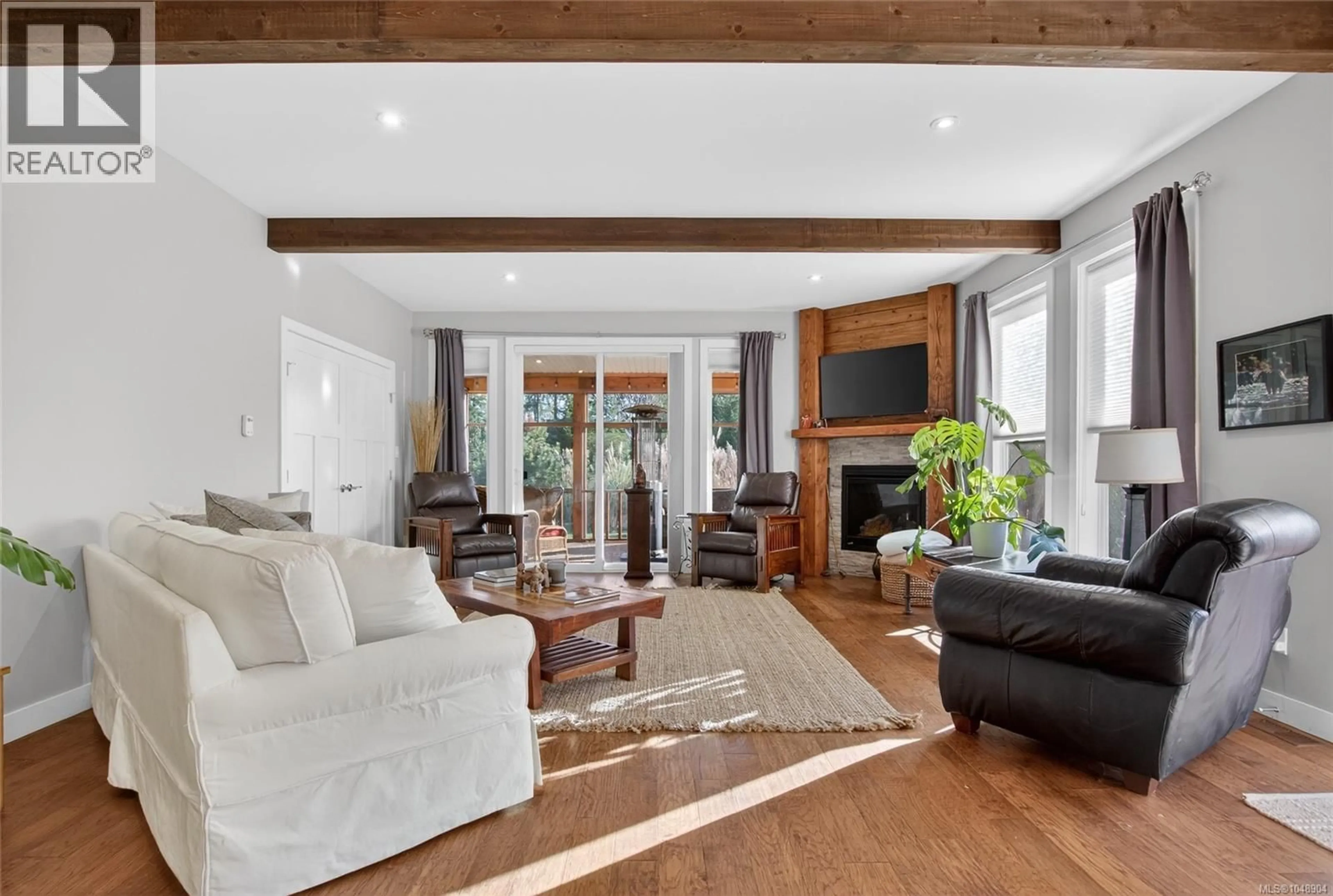 Living room with furniture, wood/laminate floor for 7284 LAKEFRONT DRIVE, Lake Cowichan British Columbia V0R2G1