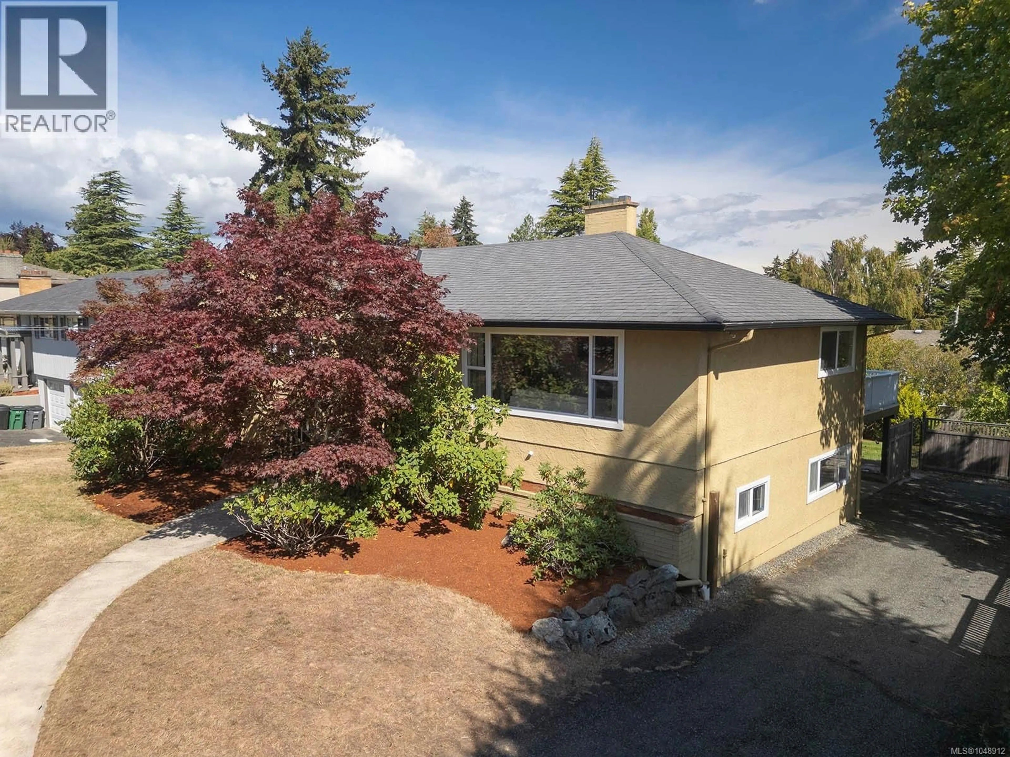 A pic from outside/outdoor area/front of a property/back of a property/a pic from drone, street for 1924 CASA MARCIA CRESCENT, Saanich British Columbia V8N2X3
