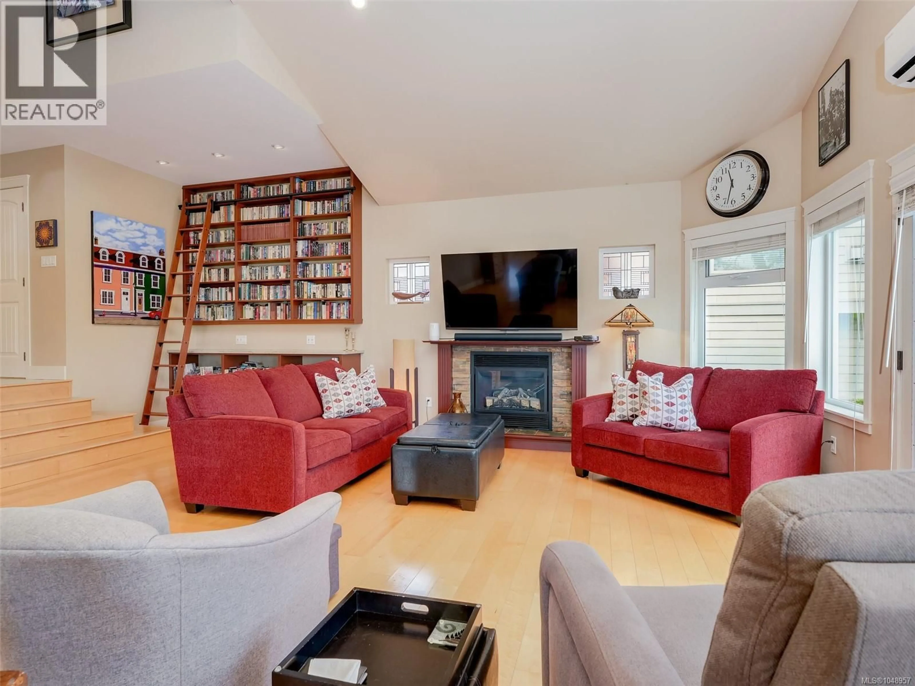 Living room with furniture, wood/laminate floor for 19 CARLY LANE, View Royal British Columbia V9B0A2