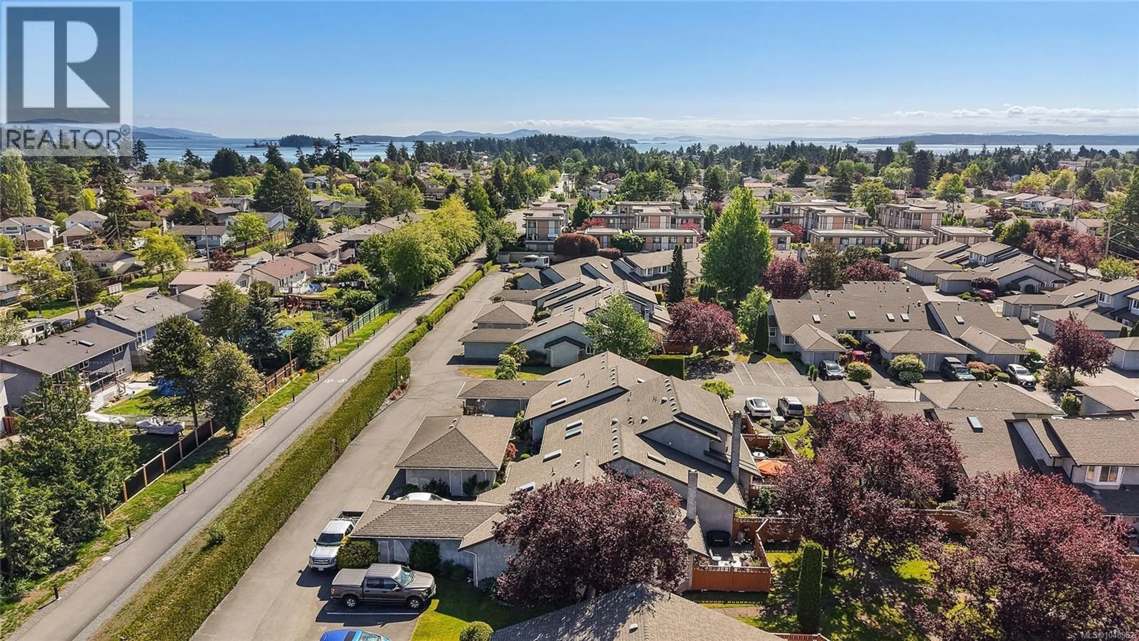 A pic from outside/outdoor area/front of a property/back of a property/a pic from drone, water/lake/river/ocean view for 23 - 2070 AMELIA AVENUE, Sidney British Columbia V8L4X6