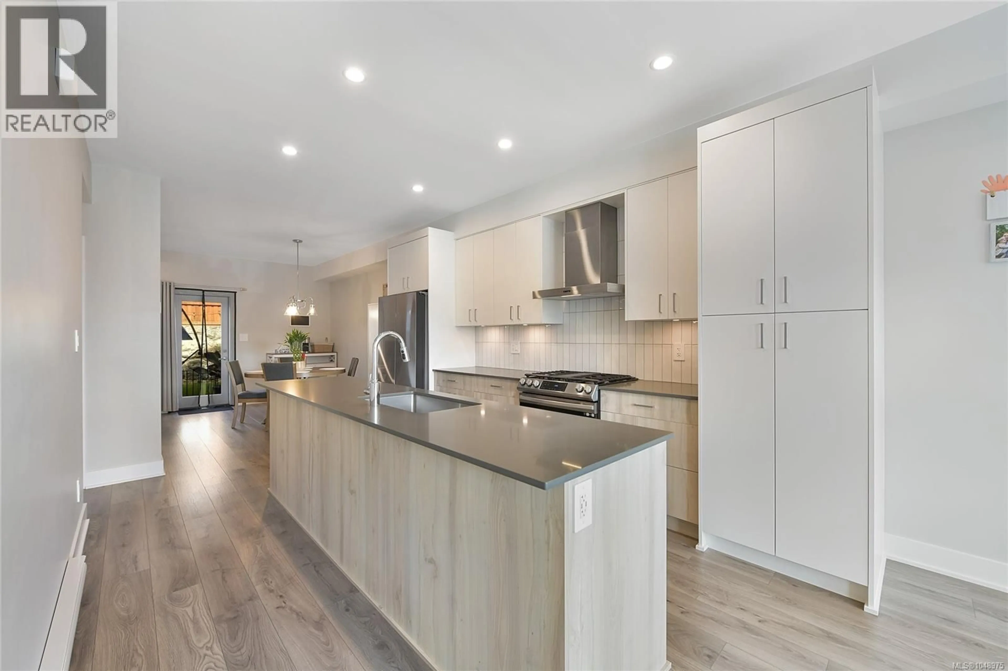 Open concept kitchen, wood/laminate floor for 1424 ATLAS DRIVE, Langford British Columbia V9B7A7