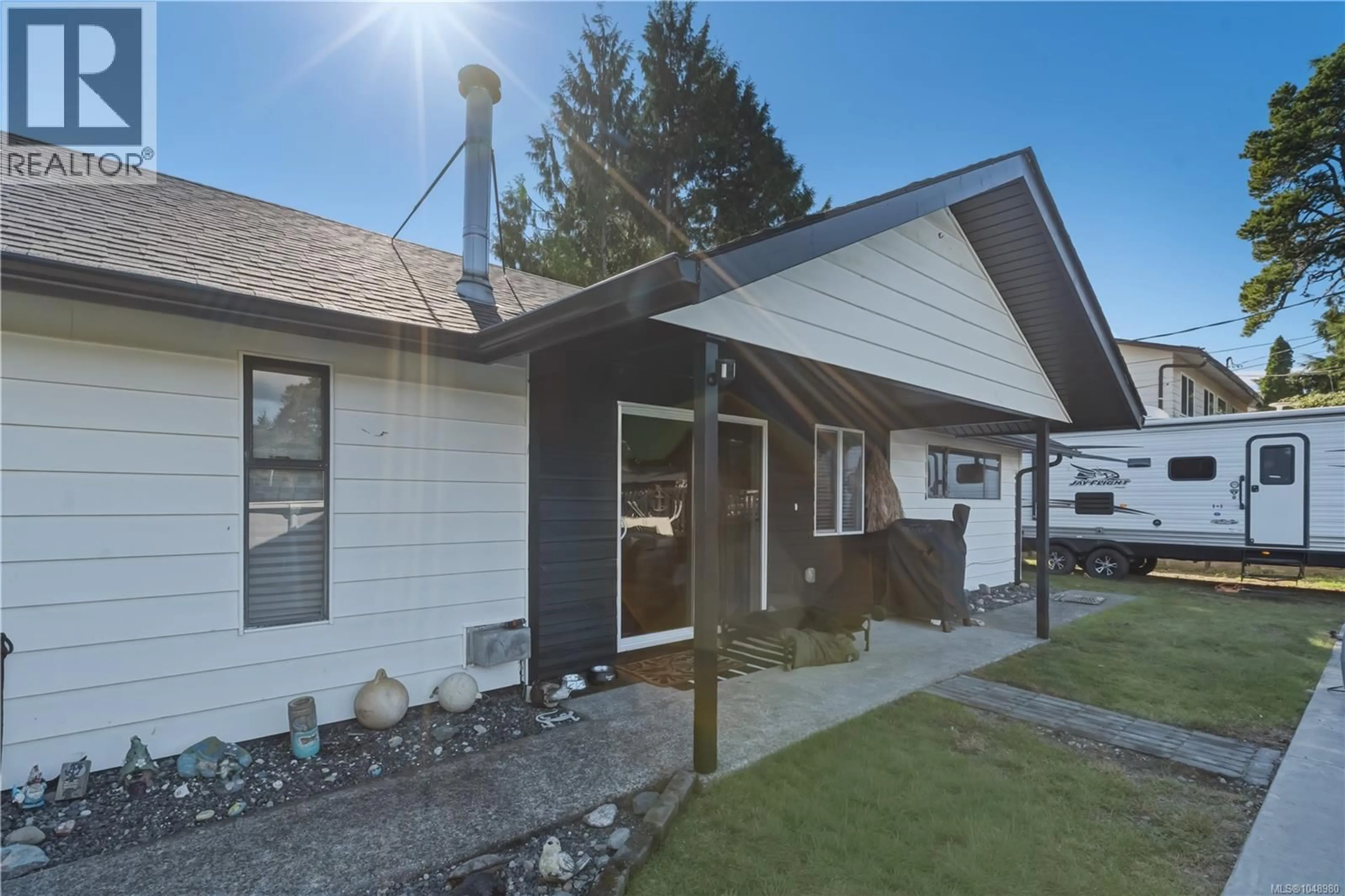 Home with vinyl exterior material, street for 1626 LARCH ROAD, Ucluelet British Columbia V0R3A0
