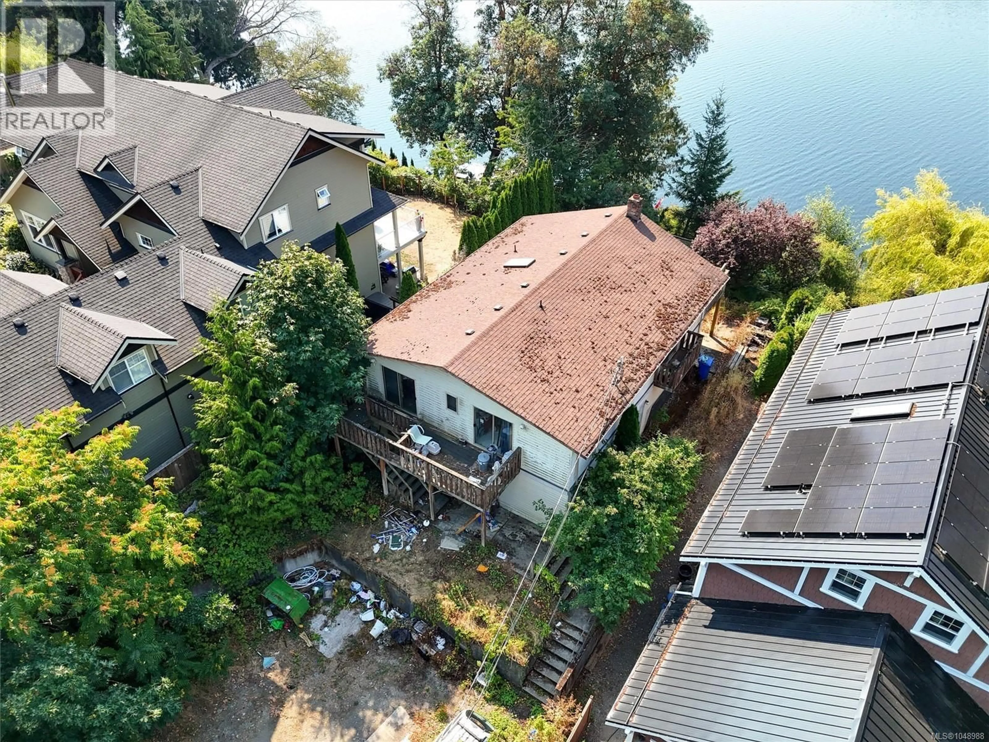 A pic from outside/outdoor area/front of a property/back of a property/a pic from drone, water/lake/river/ocean view for 2815 LAKE END ROAD, Langford British Columbia V9B2W2