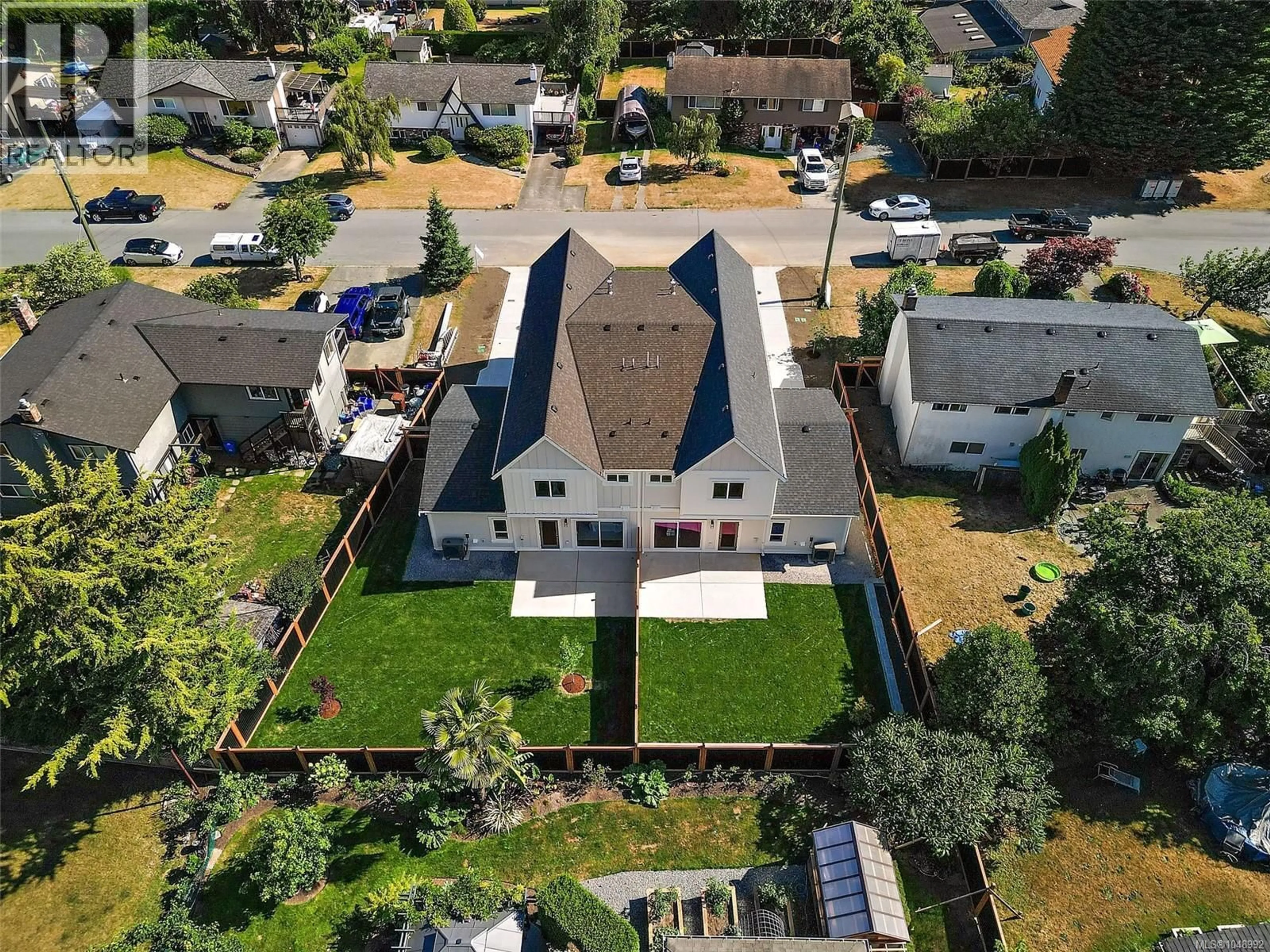 A pic from outside/outdoor area/front of a property/back of a property/a pic from drone, street for 102 - 1870 DONEY ROAD, Central Saanich British Columbia V8M1K6
