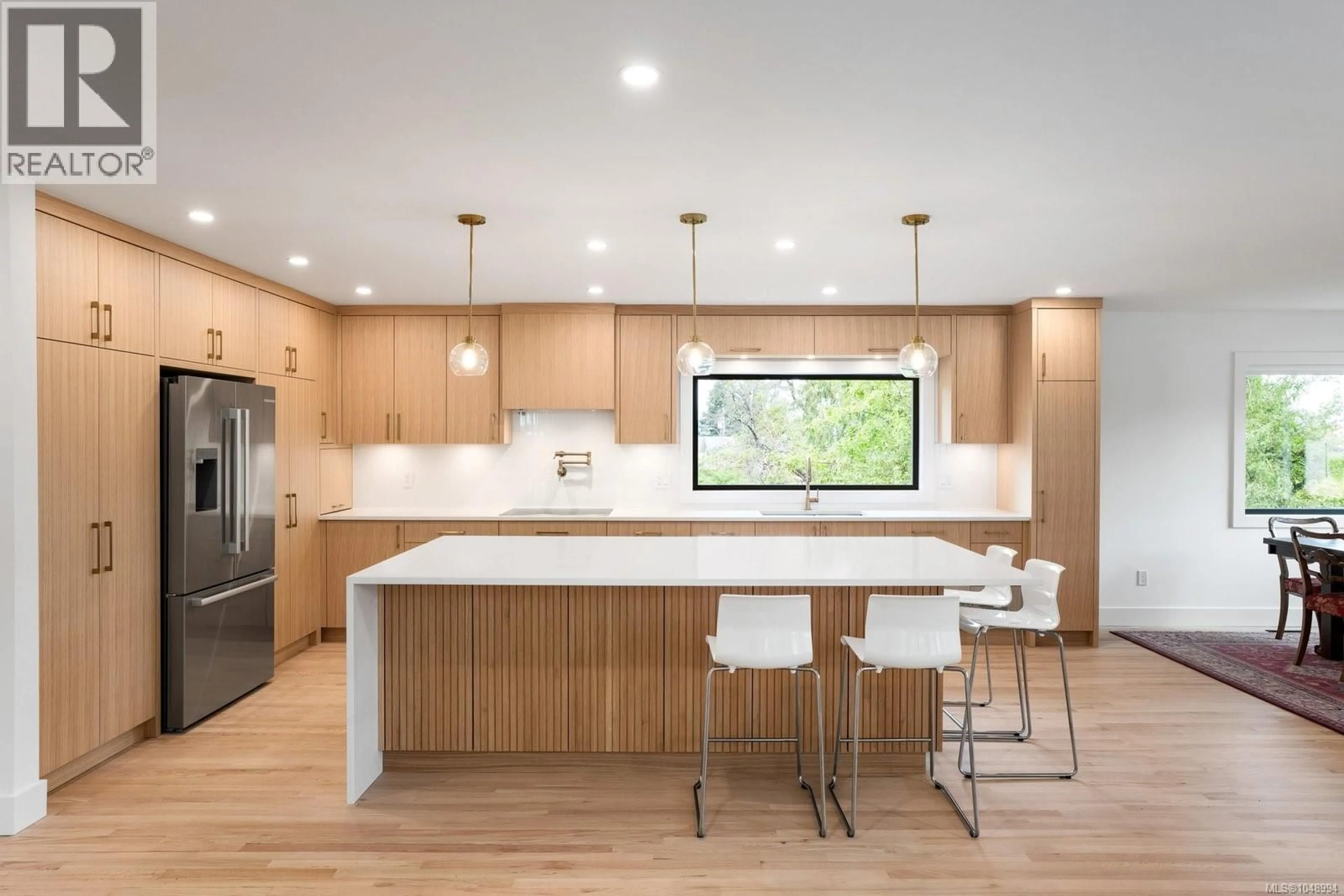 Contemporary kitchen, wood/laminate floor for 1601 MILEVA LANE, Saanich British Columbia V8N2V6