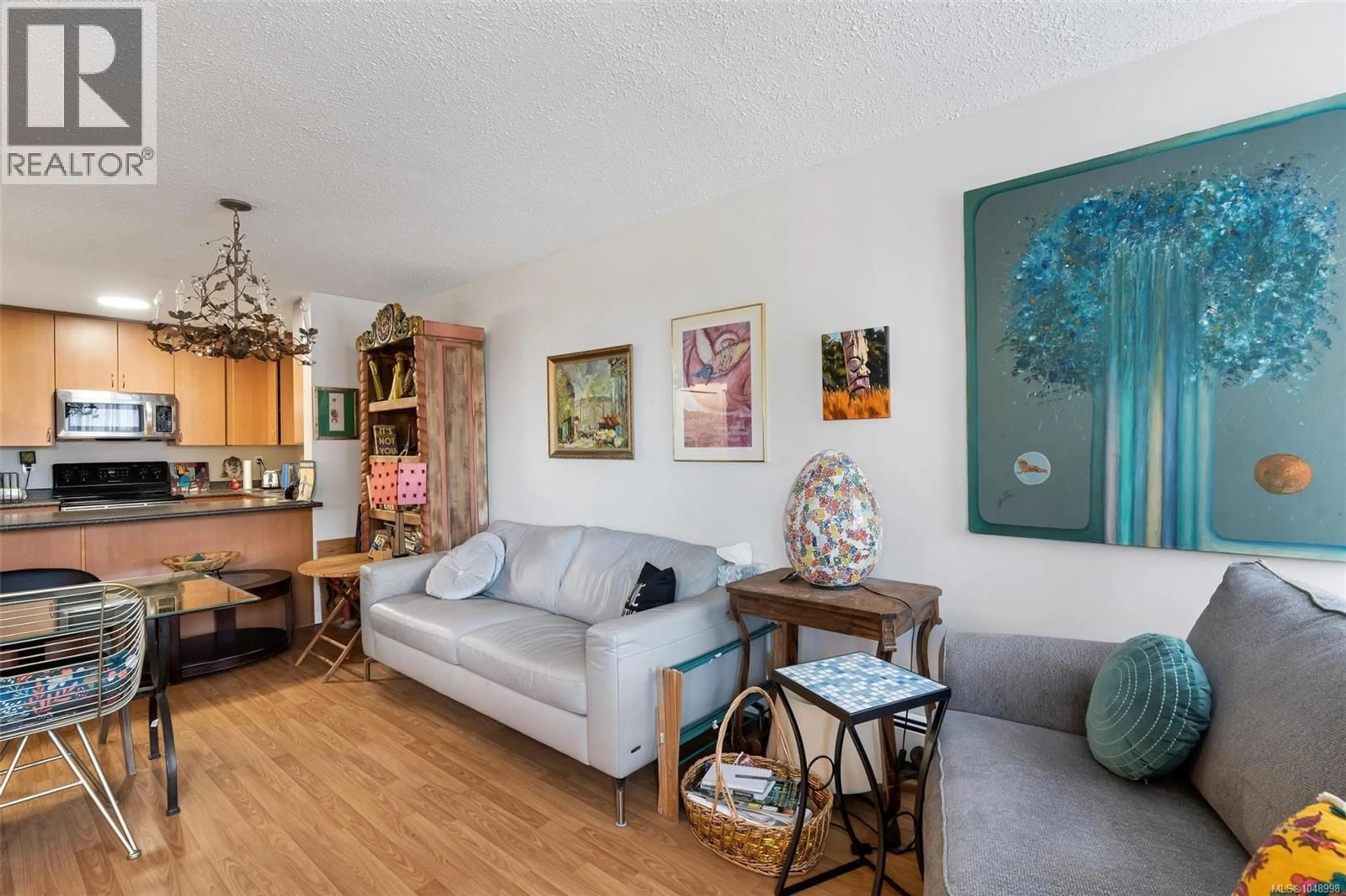 Living room with furniture, wood/laminate floor for 511 - 1745 LEIGHTON ROAD, Victoria British Columbia V8R6R6